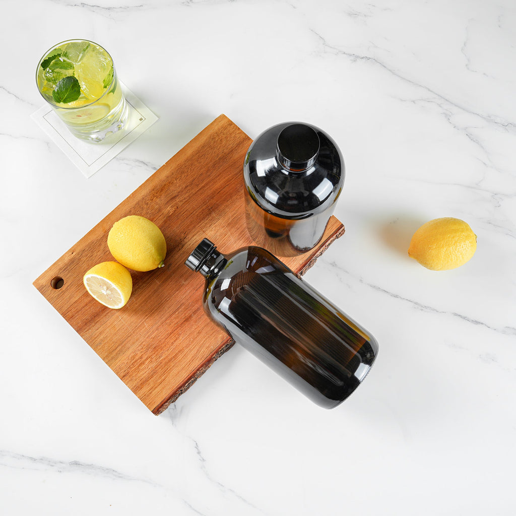 Vetri 32 oz Boston Round Amber Glass Bottle - with Black Phenolic Cap - 3 3/4" x 3 3/4" x 8" - 12 count box