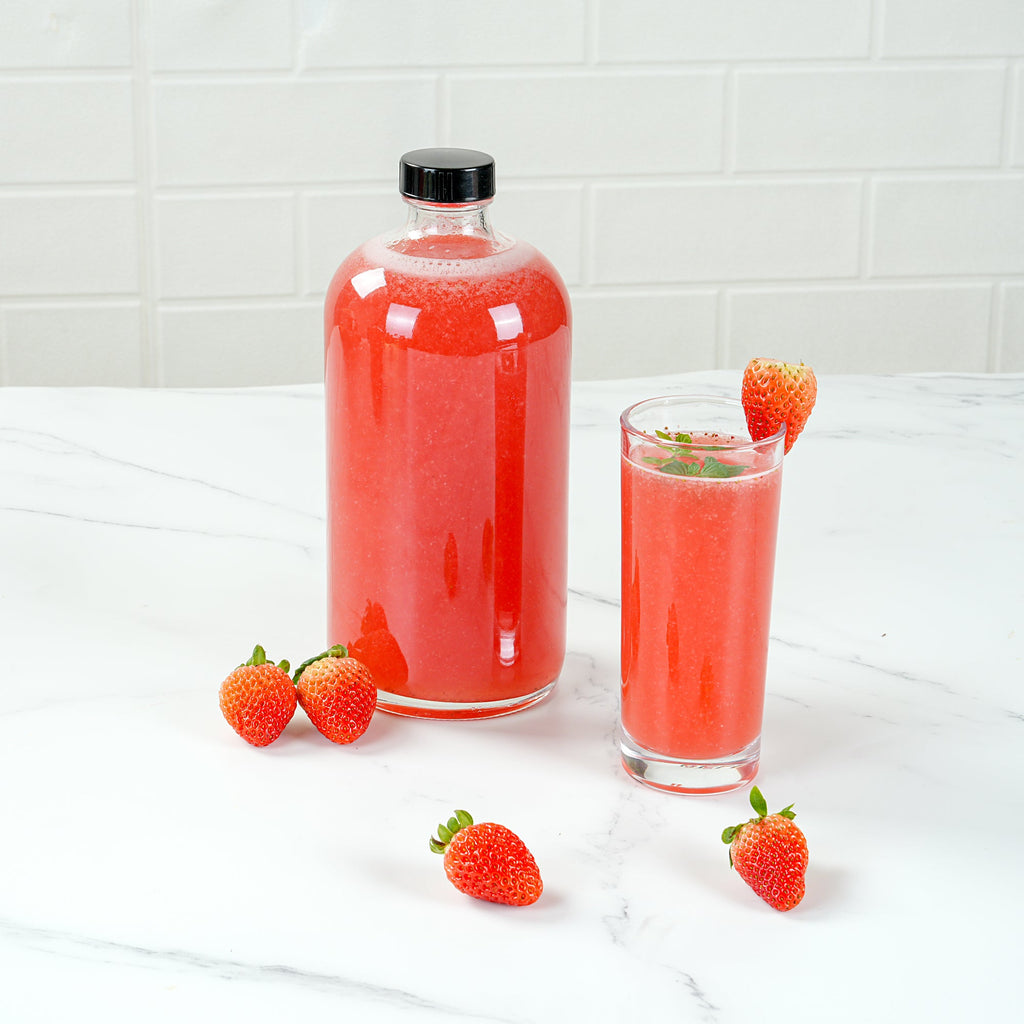 Vetri 32 oz Boston Round Clear Glass Bottle - with Black Phenolic Cap - 3 3/4" x 3 3/4" x 8" - 12 count box