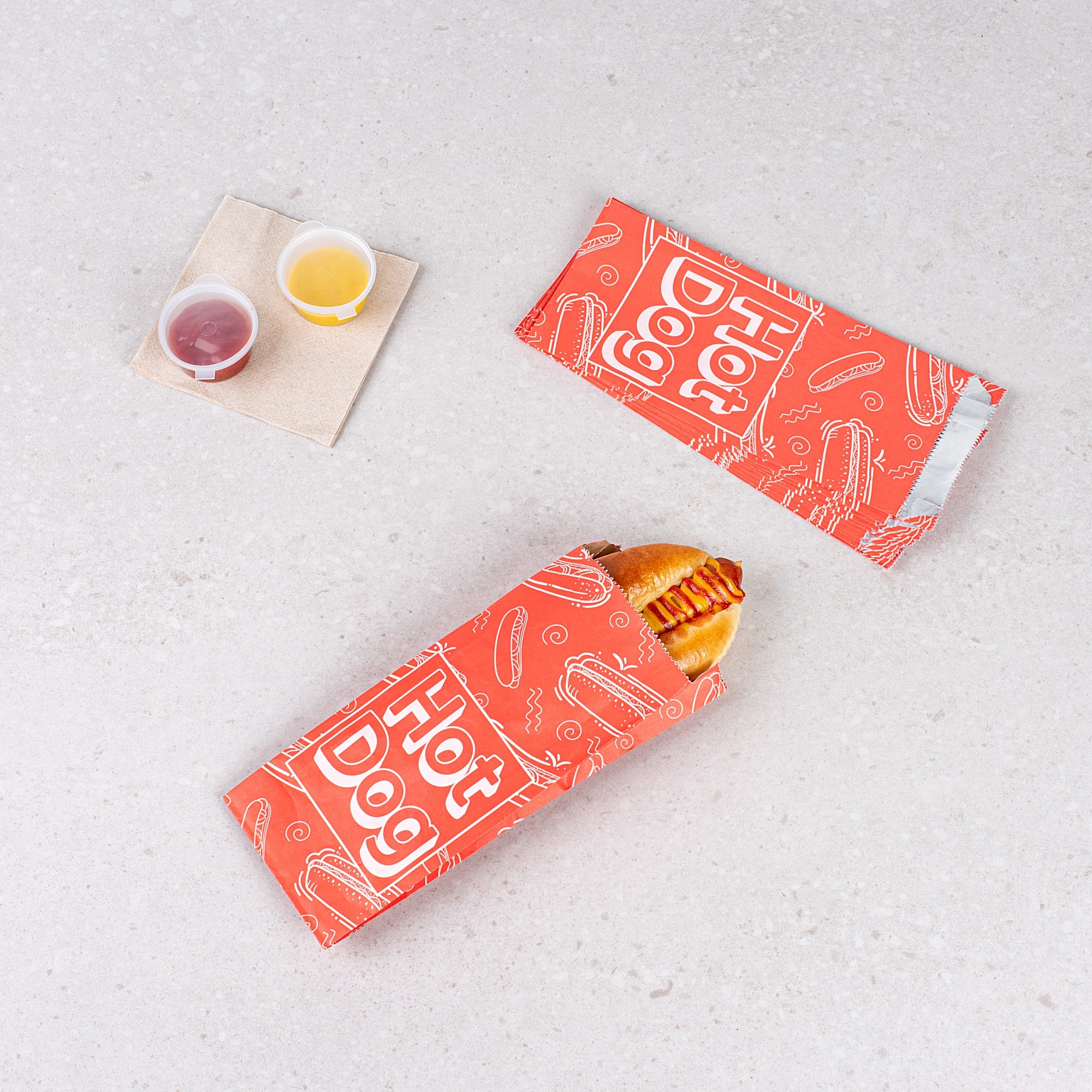 Bag Tek Red Paper Printed Small Hot Dog Foil Bag - 3 3/4" x 1 1/4" x 9" - 100 count box