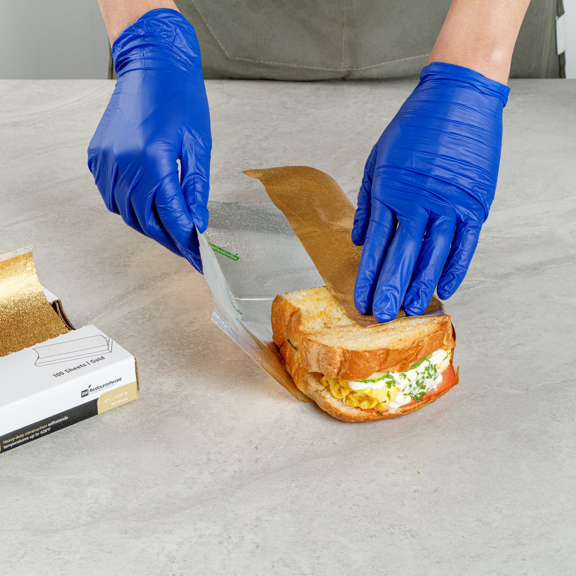 Foil Lux Foodservice Gold Aluminum Foil Pop-Up Sheet - Interfolded, Embossed - 12" x 10 3/4" - 100 count box