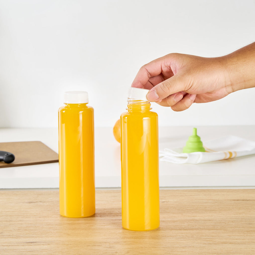 Bottle Tek 16 oz Round Clear Plastic Cold Pressed Juice Bottle - with Safety Cap - 2 1/4" x 2 1/4" x 8 1/4" - 100 count box