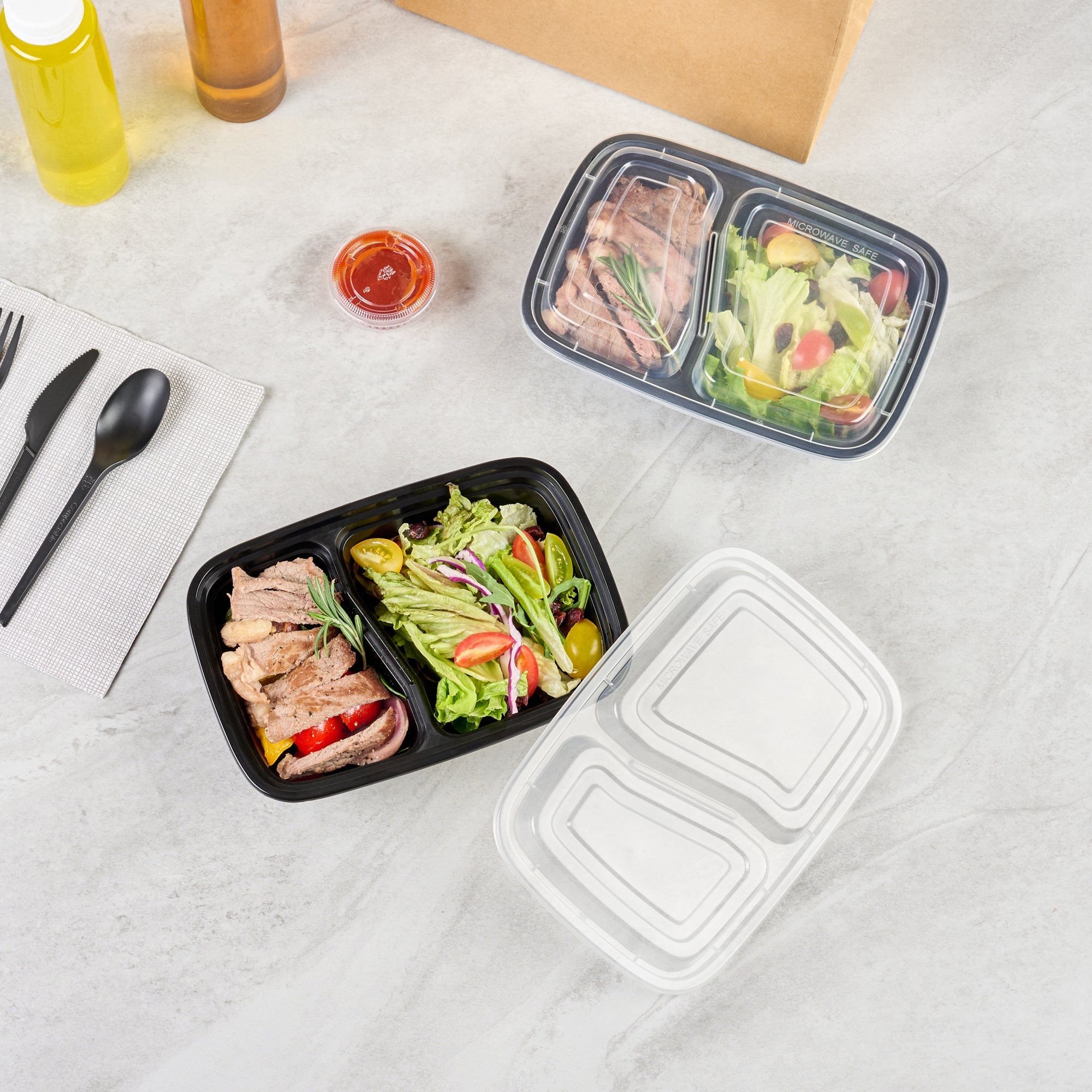 Asporto 32 oz Black Plastic 2 Compartment Food Container - with Clear Lid, Microwavable - 8 3/4" x 6" x 2" - 50 count box
