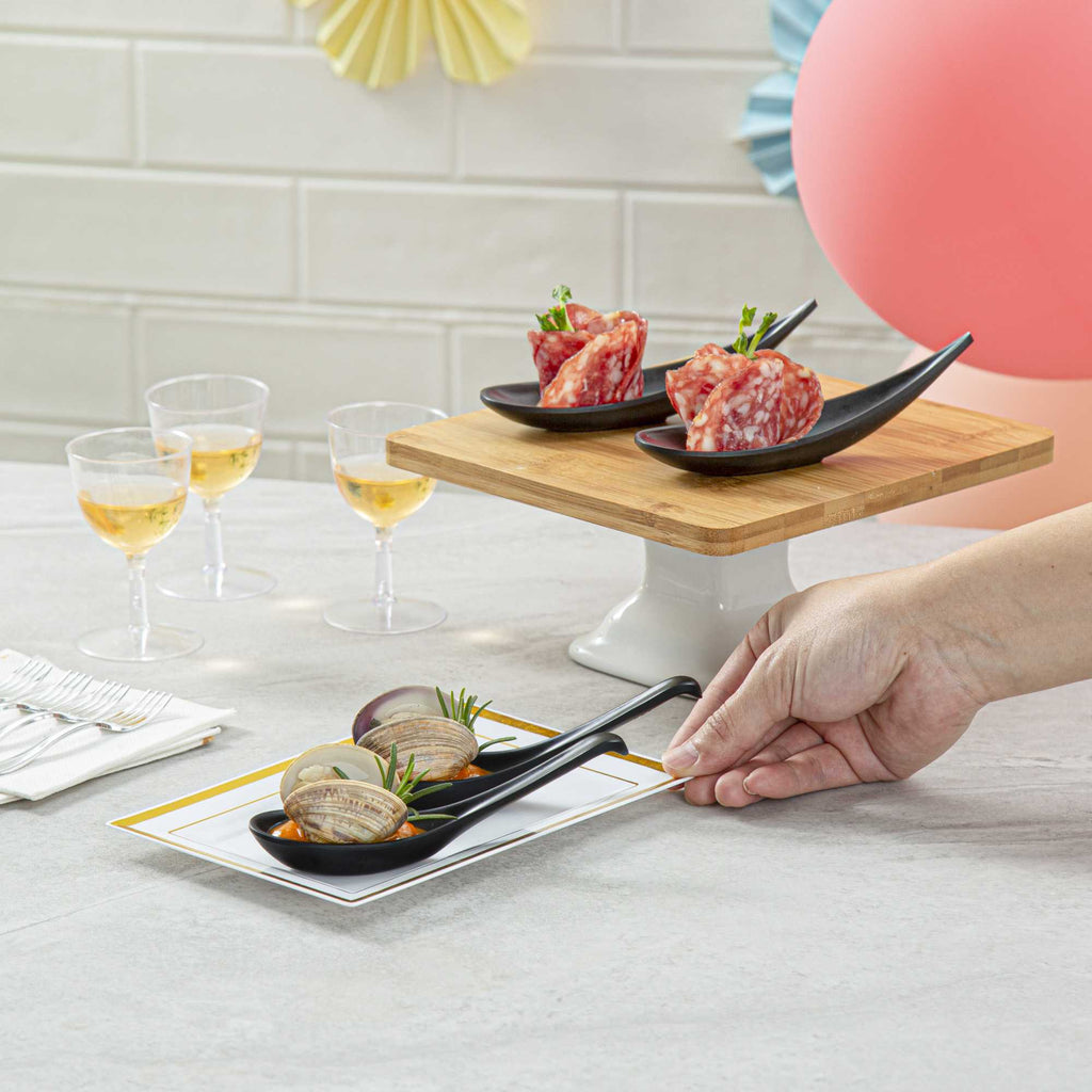 Voga 1 oz Black Melamine Tasting Spoon - Japonais, Curva - 5 3/4" x 1 1/2" x 1" - 10 count box