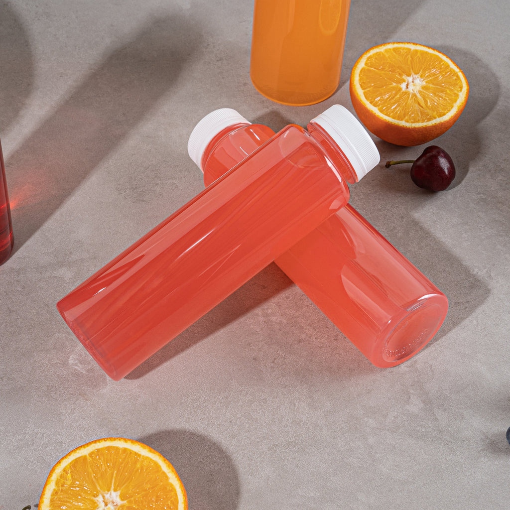 Bottle Tek 12 oz Round Clear Plastic Cold Pressed Juice Bottle - with Safety Cap - 2" x 2" x 7 1/4" - 100 count box