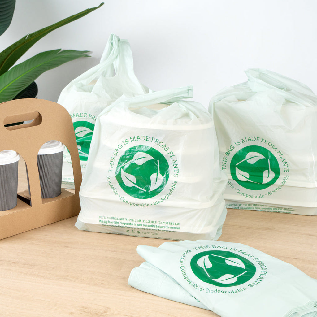 Basic Nature Green Plastic T-Shirt Bag - 1/6 Size, Compostable - 12" x 6 1/2" x 22" - 100 count box