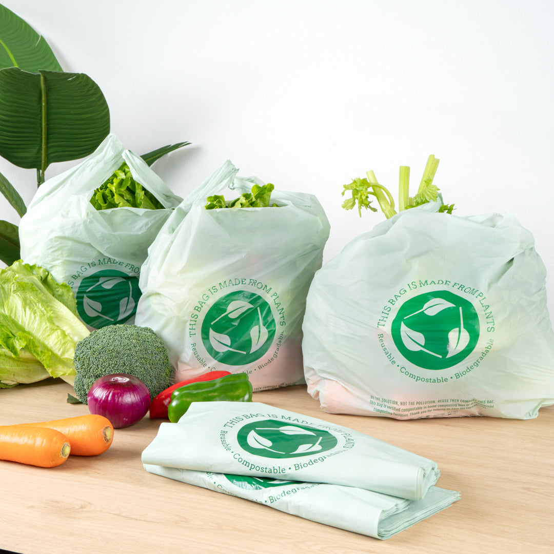 Basic Nature Green Plastic T-Shirt Bag - 1/6 Size, Compostable - 12" x 6 1/2" x 22" - 500 count box