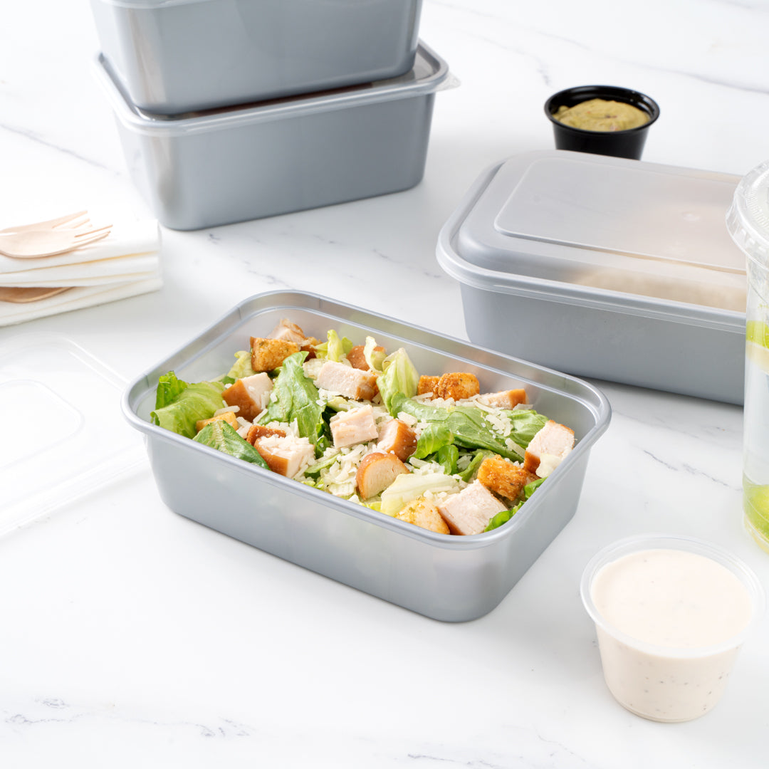 Futura 22 oz Silver Plastic Take Out Container - with Clear Lid, Microwavable - 6 3/4" x 4 1/2" x 2 1/4" - 100 count box