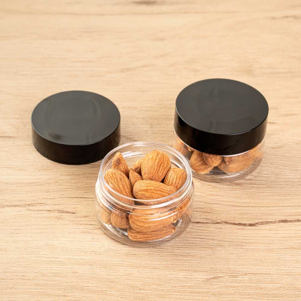 Chef 101 1 oz Round Clear Plastic Candy and Snack Jar - with Black Plastic Lid - 2" x 2" x 1 1/4" - 100 count box