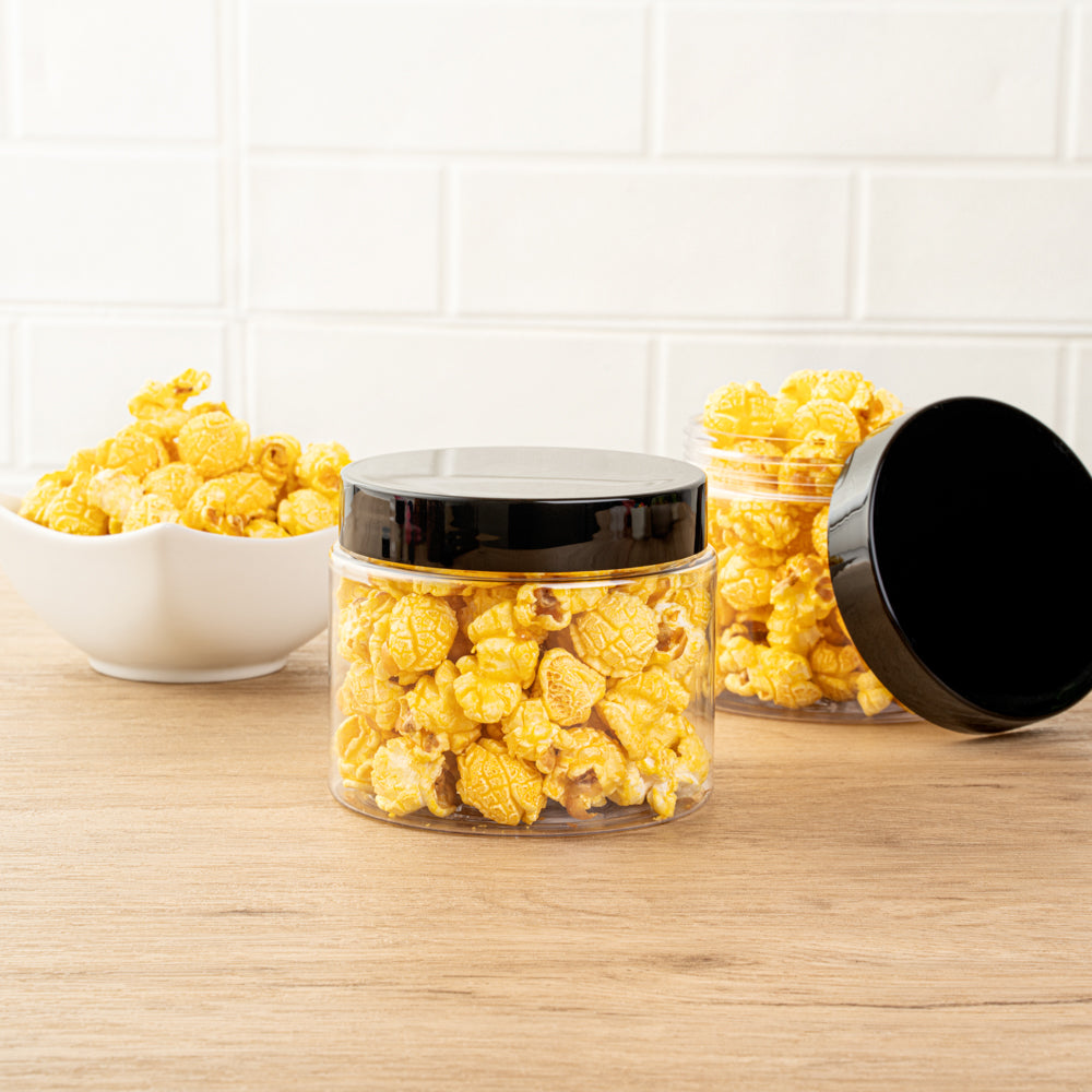 Chef 101 16 oz Round Clear Plastic Candy and Snack Jar - with Black Plastic Lid - 3 3/4" x 3 3/4" x 3" - 10 count box
