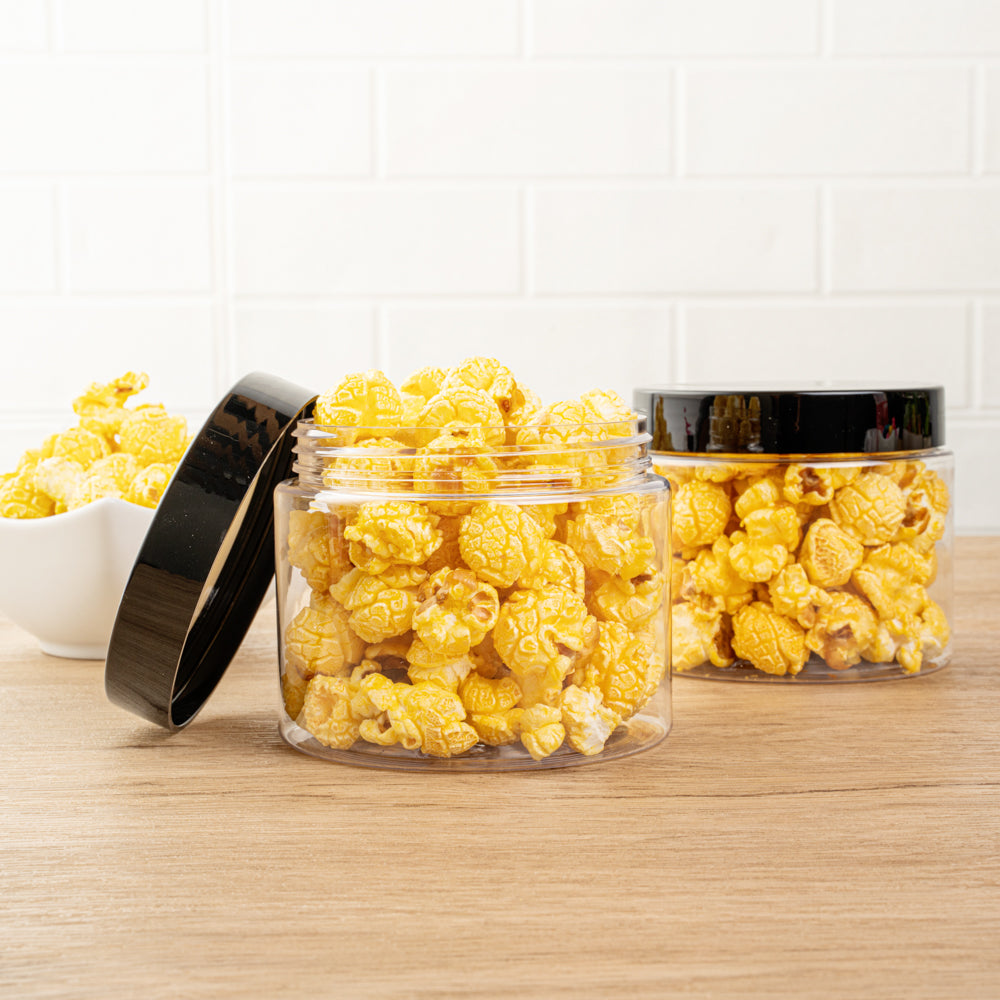 Chef 101 16 oz Round Clear Plastic Candy and Snack Jar - with Black Plastic Lid - 3 3/4" x 3 3/4" x 3" - 10 count box