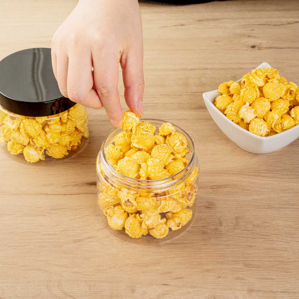 Chef 101 16 oz Round Clear Plastic Candy and Snack Jar - with Black Plastic Lid - 3 3/4" x 3 3/4" x 3" - 100 count box