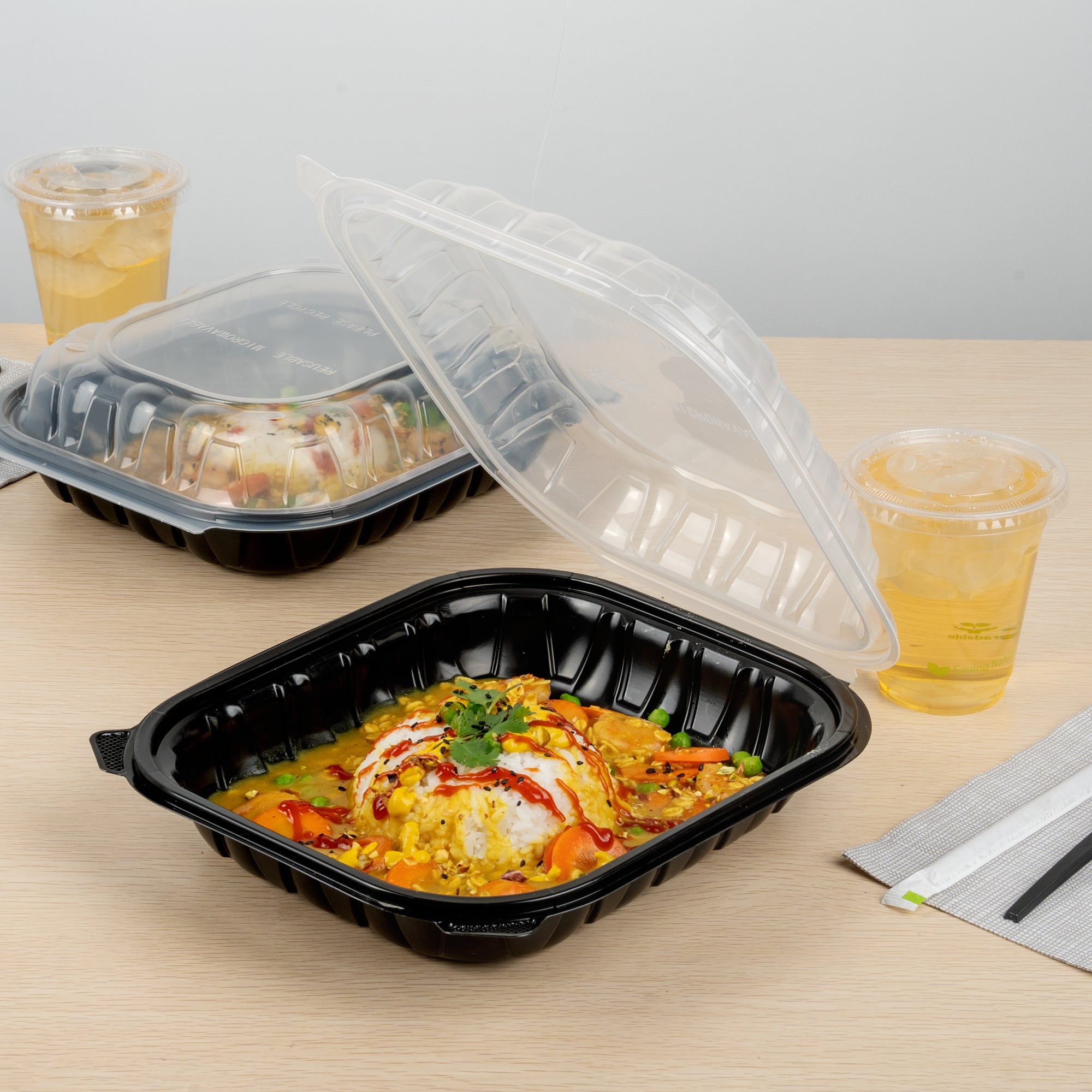 Thermo Tek 54 oz Black Plastic Clamshell Container - Microwavable - 10 1/4" x 9" x 3" - 50 count box