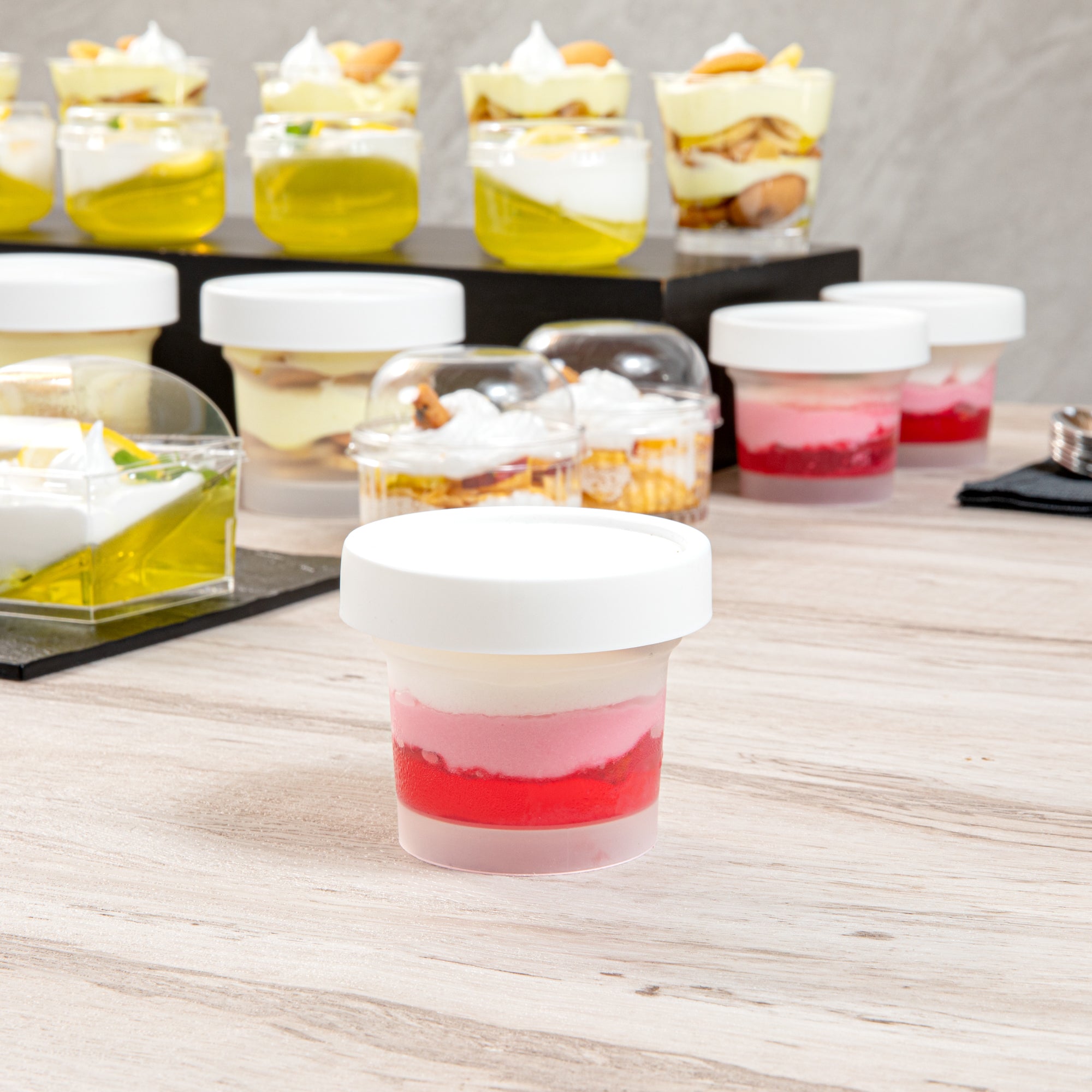 Mini Serve 5 oz Round Clear Plastic Dessert Cup - with Lid - 3'' x 3'' x 2 1/2'' - 25 count box