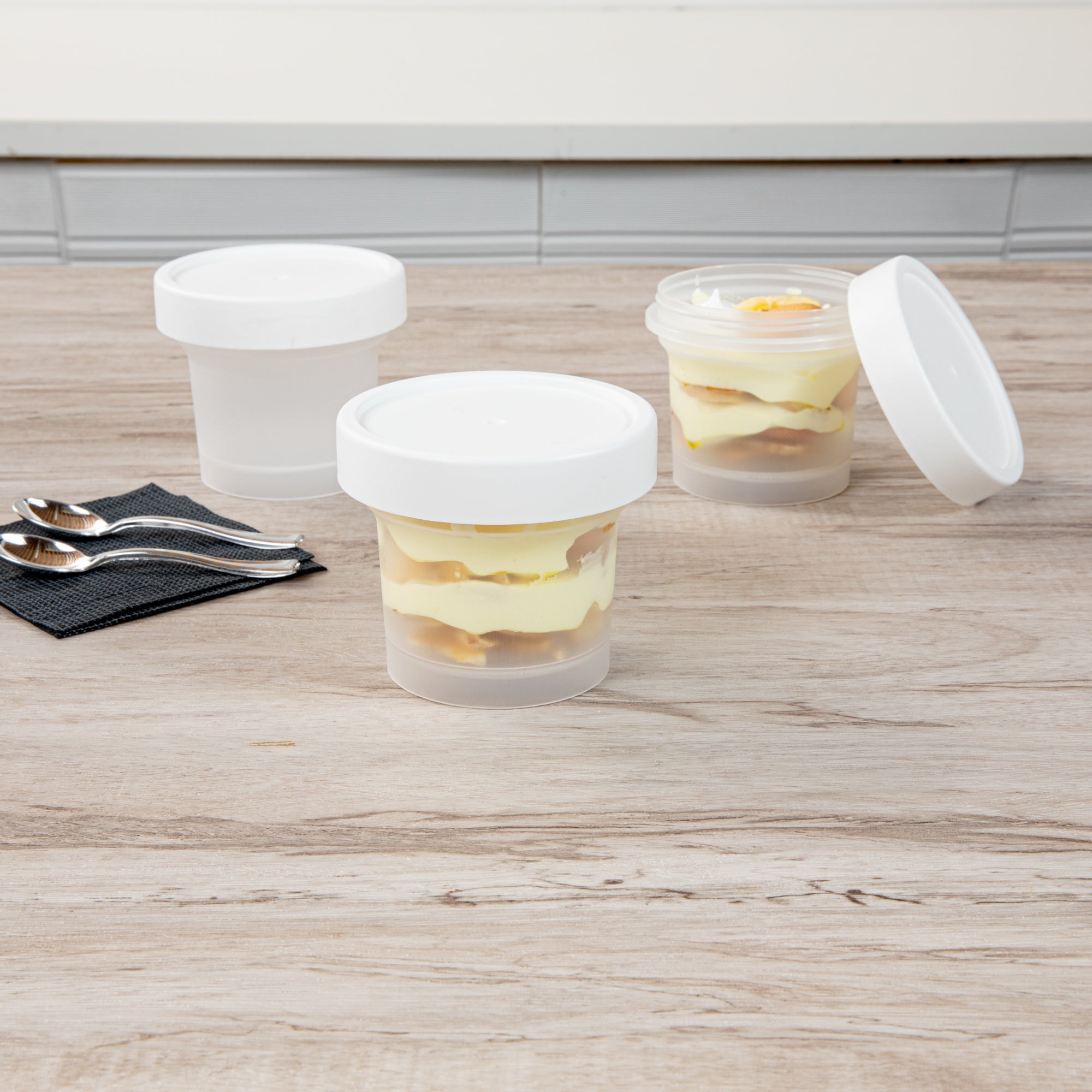 Mini Serve 8 oz Round Clear Plastic Dessert Cup - with Lid - 3 1/2'' x 3 1/2'' x 3'' - 25 count box