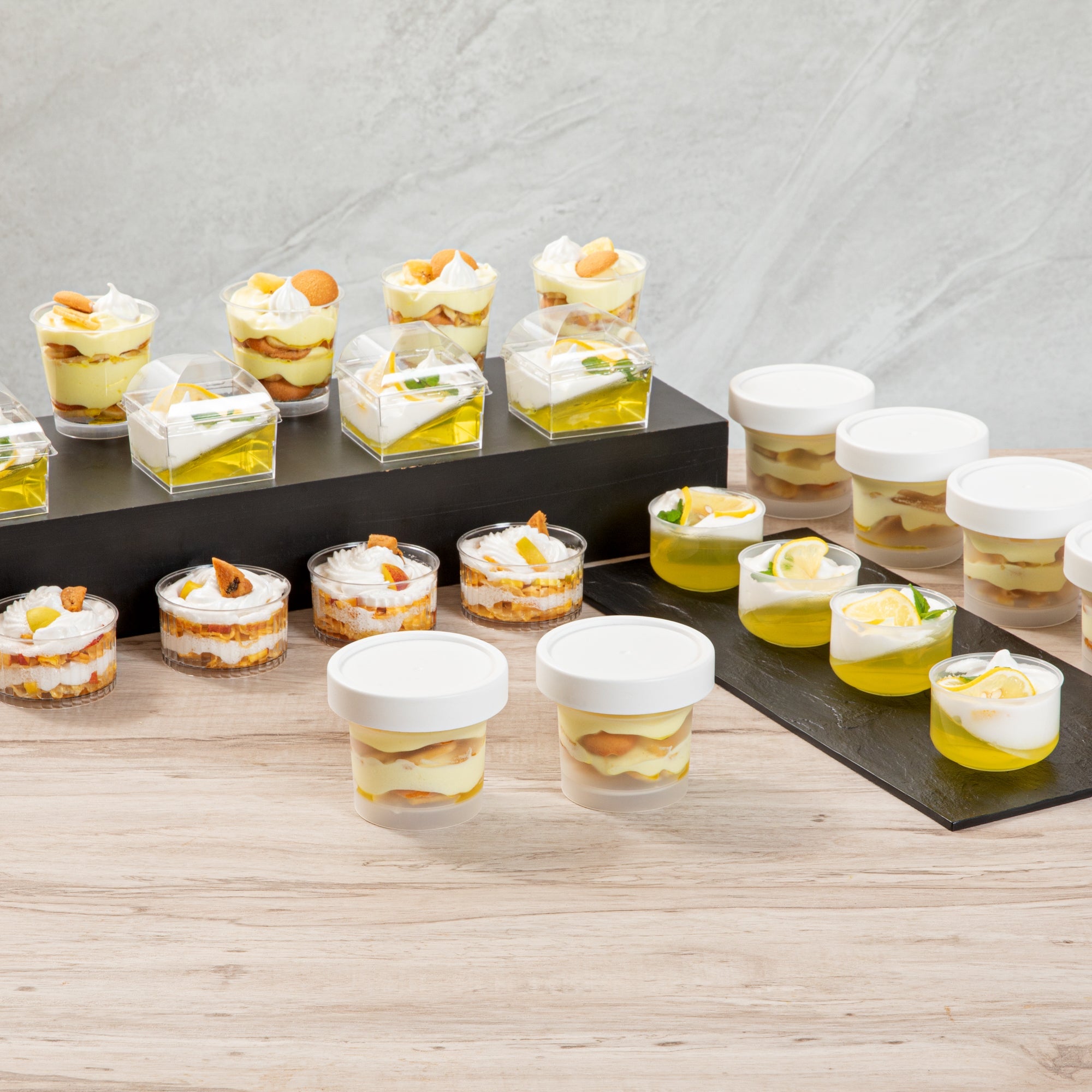 Mini Serve 8 oz Round Clear Plastic Dessert Cup - with Lid - 3 1/2'' x 3 1/2'' x 3'' - 25 count box