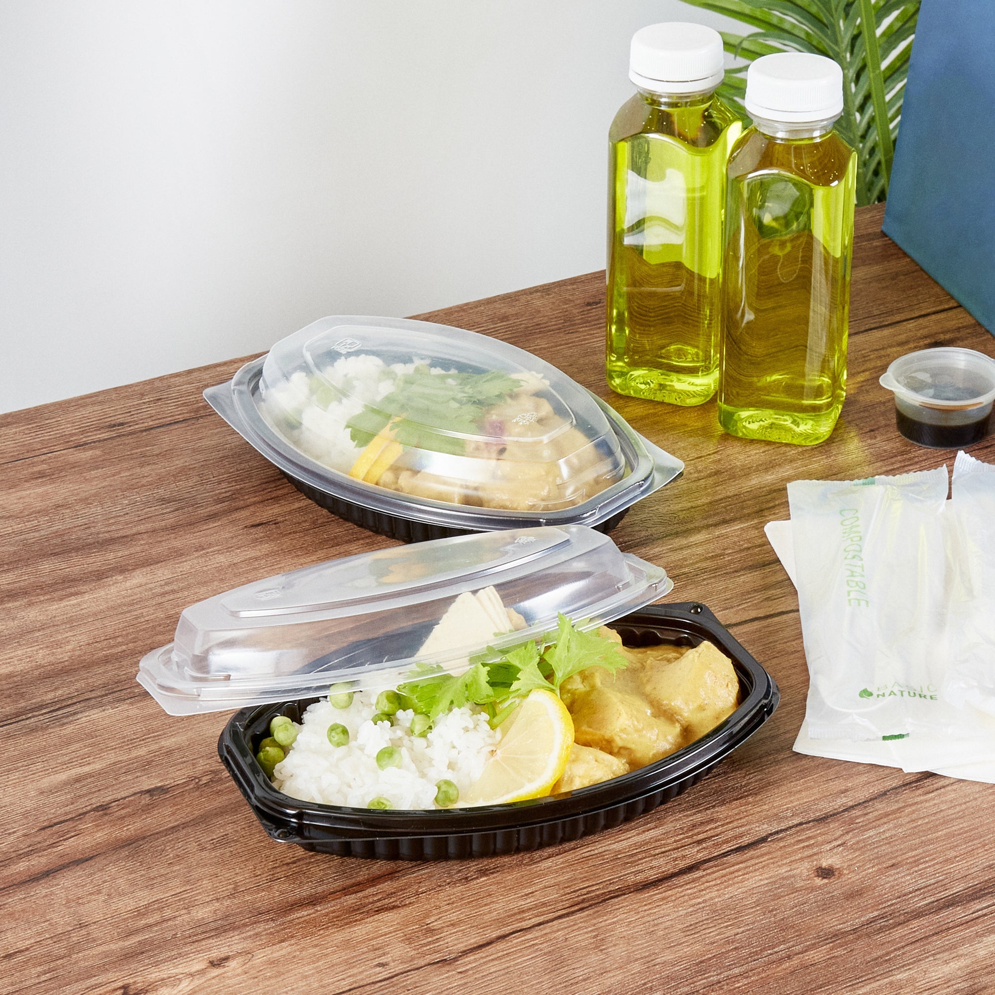 Chef 101 12 oz Oval Black Plastic Food Container - with Clear Lid, Microwavable - 8" x 5 1/2" x 2" - 100 count box
