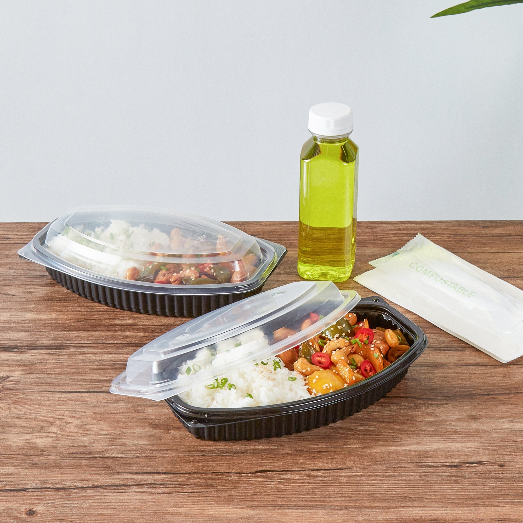 Chef 101 21 oz Oval Black Plastic Food Container - with Clear Lid, Microwavable - 9 1/4" x 5 3/4" x 2 1/4" - 100 count box
