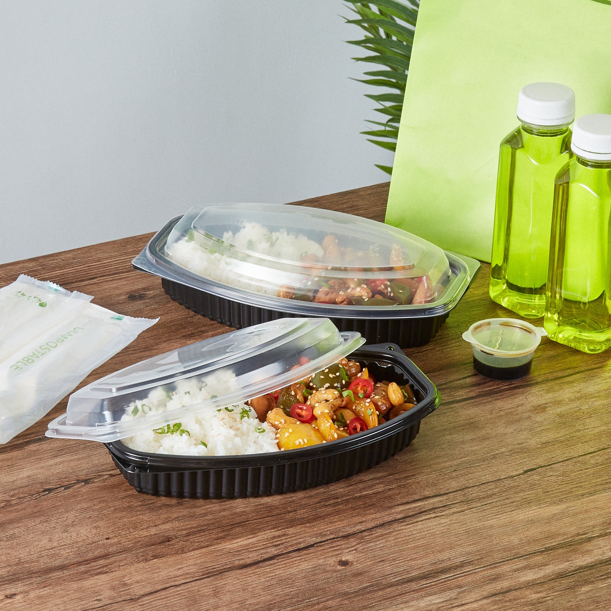 Chef 101 21 oz Oval Black Plastic Food Container - with Clear Lid, Microwavable - 9 1/4" x 5 3/4" x 2 1/4" - 100 count box