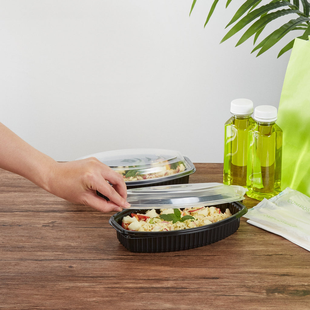 Chef 101 24 oz Oval Black Plastic Food Container - with Clear Lid, Microwavable - 9 1/4" x 5 3/4" x 2 1/2" - 50 count box