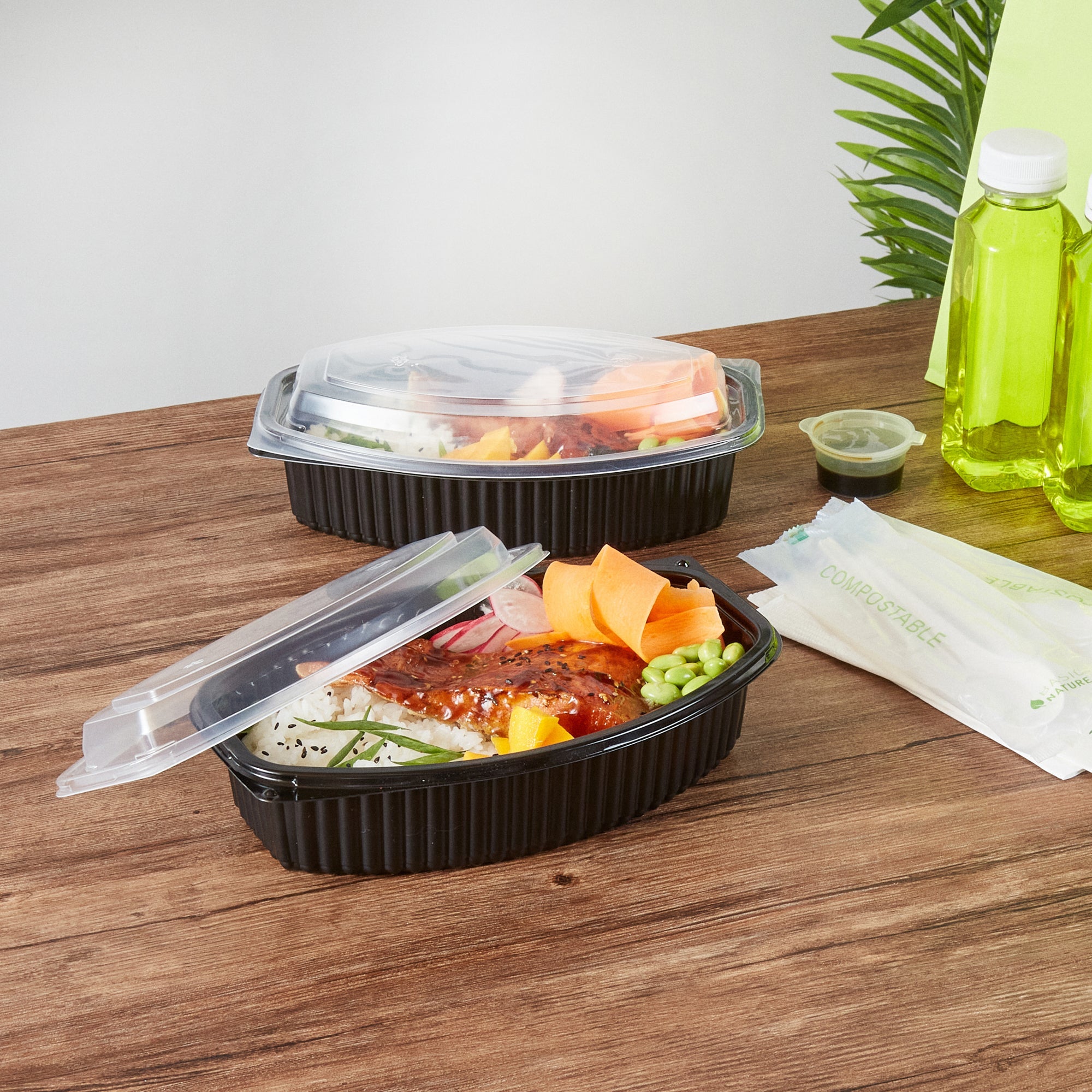 Chef 101 32 oz Oval Black Plastic Food Container - with Clear Lid, Microwavable - 9 1/4" x 5 3/4" x 3" - 100 count box