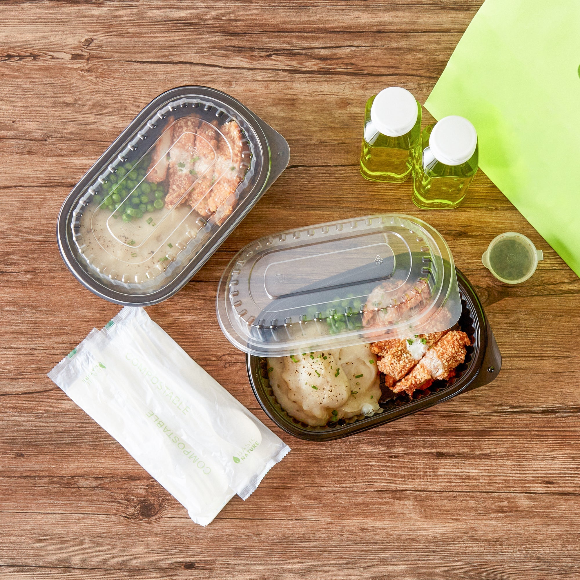 Chef 101 32 oz Oval Black Plastic Food Container - with Clear Dome Lid, Microwavable - 9 1/4" x 6" x 2 1/2" - 50 count box