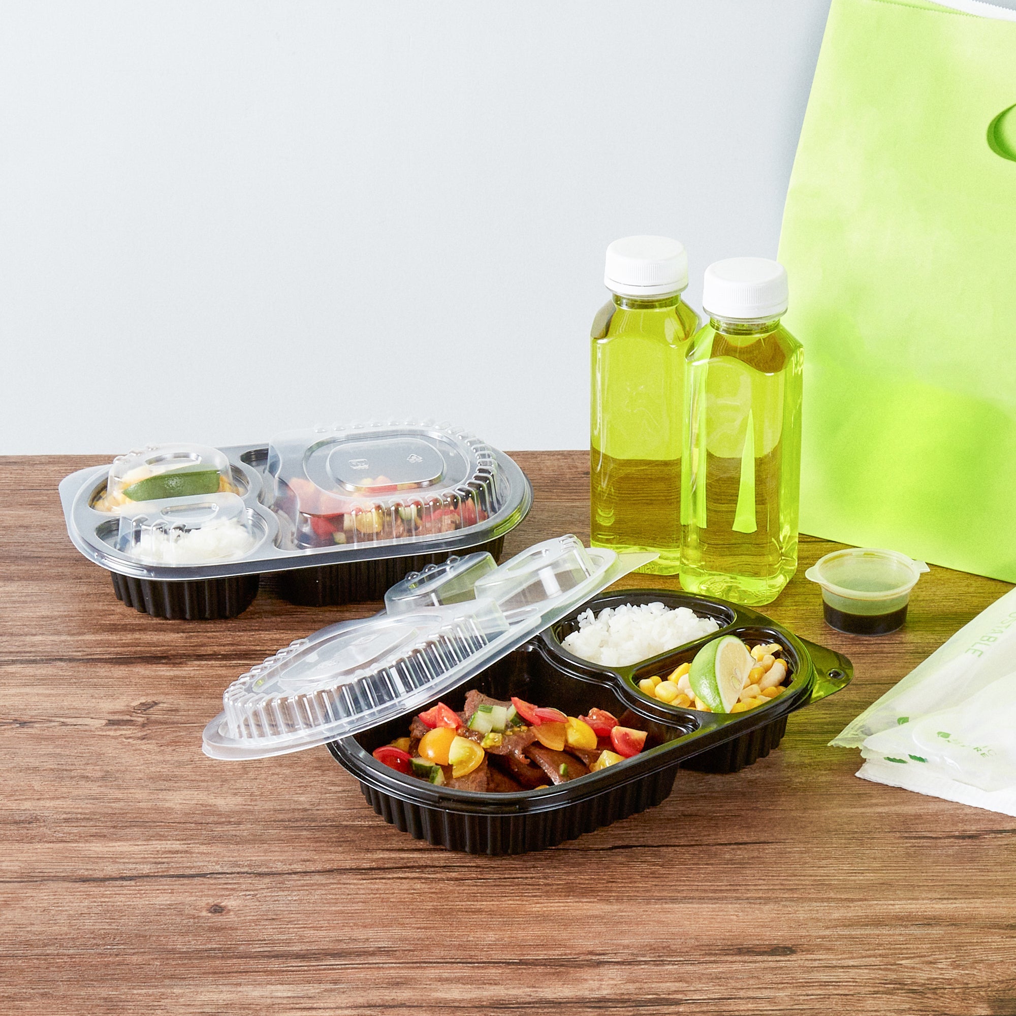 Chef 101 19 oz Oval Black Plastic Food Container - with Clear Lid, 3 Compartments, Microwavable - 9 1/4" x 6" x 2 1/4" - 50 count box