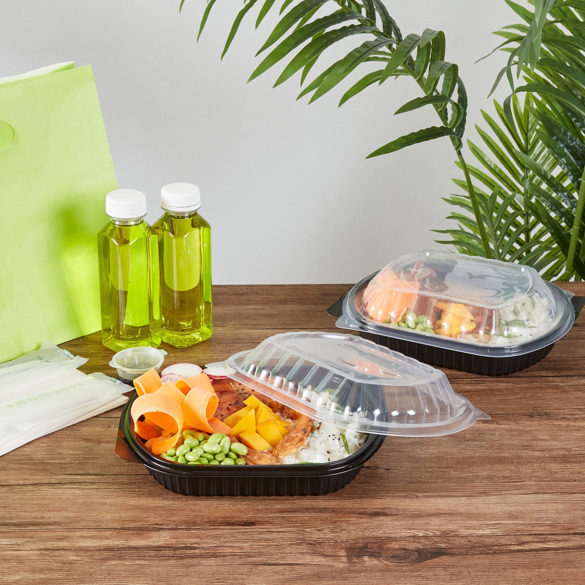 Chef 101 34 oz Oval Black Plastic Food Container - with Clear Lid, Microwavable - 9 1/2" x 8" x 2 3/4" - 100 count box