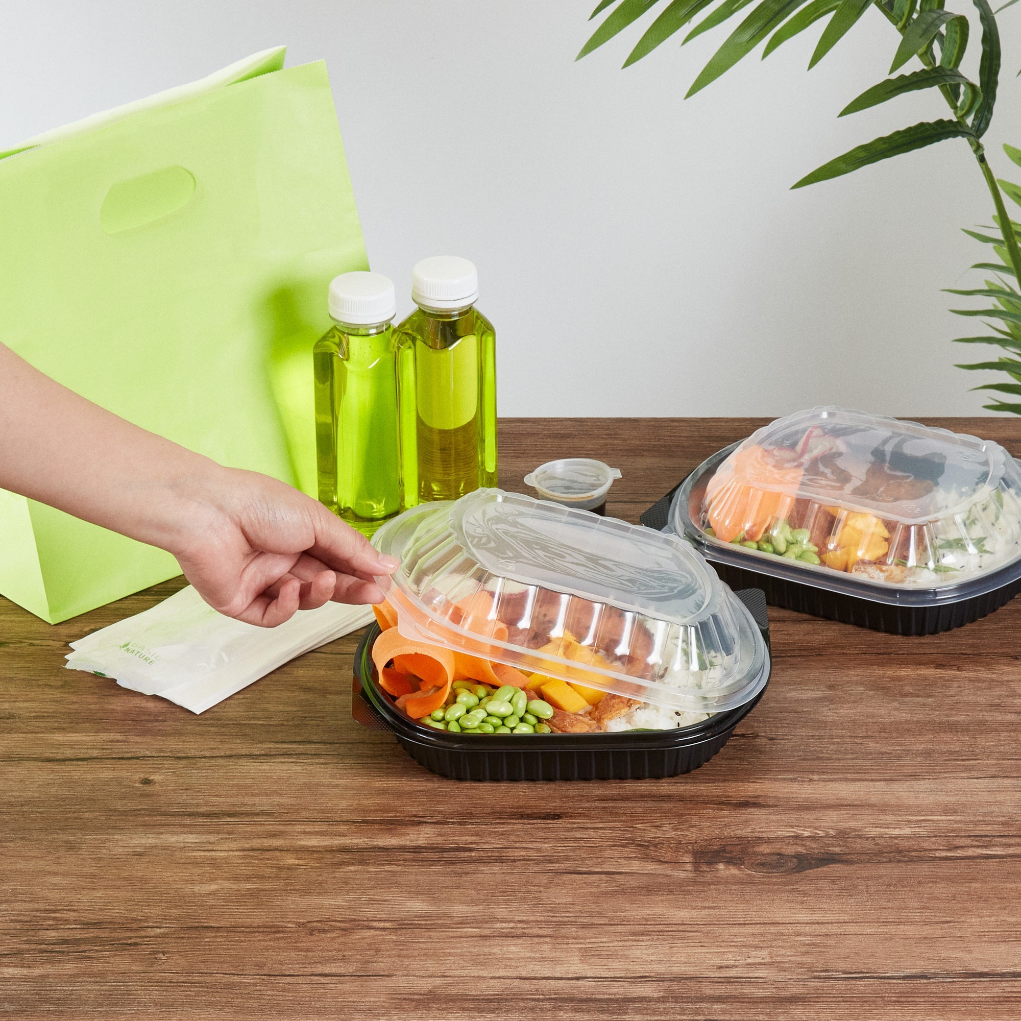 Chef 101 34 oz Oval Black Plastic Food Container - with Clear Lid, Microwavable - 9 1/2" x 8" x 2 3/4" - 100 count box