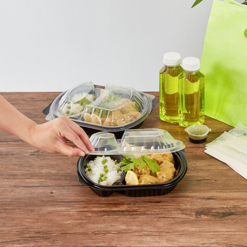 Chef 101 28 oz Oval Black Plastic Food Container - with Clear Lid, 2 Compartments, Microwavable - 9 1/2" x 8" x 2 3/4" - 100 count box