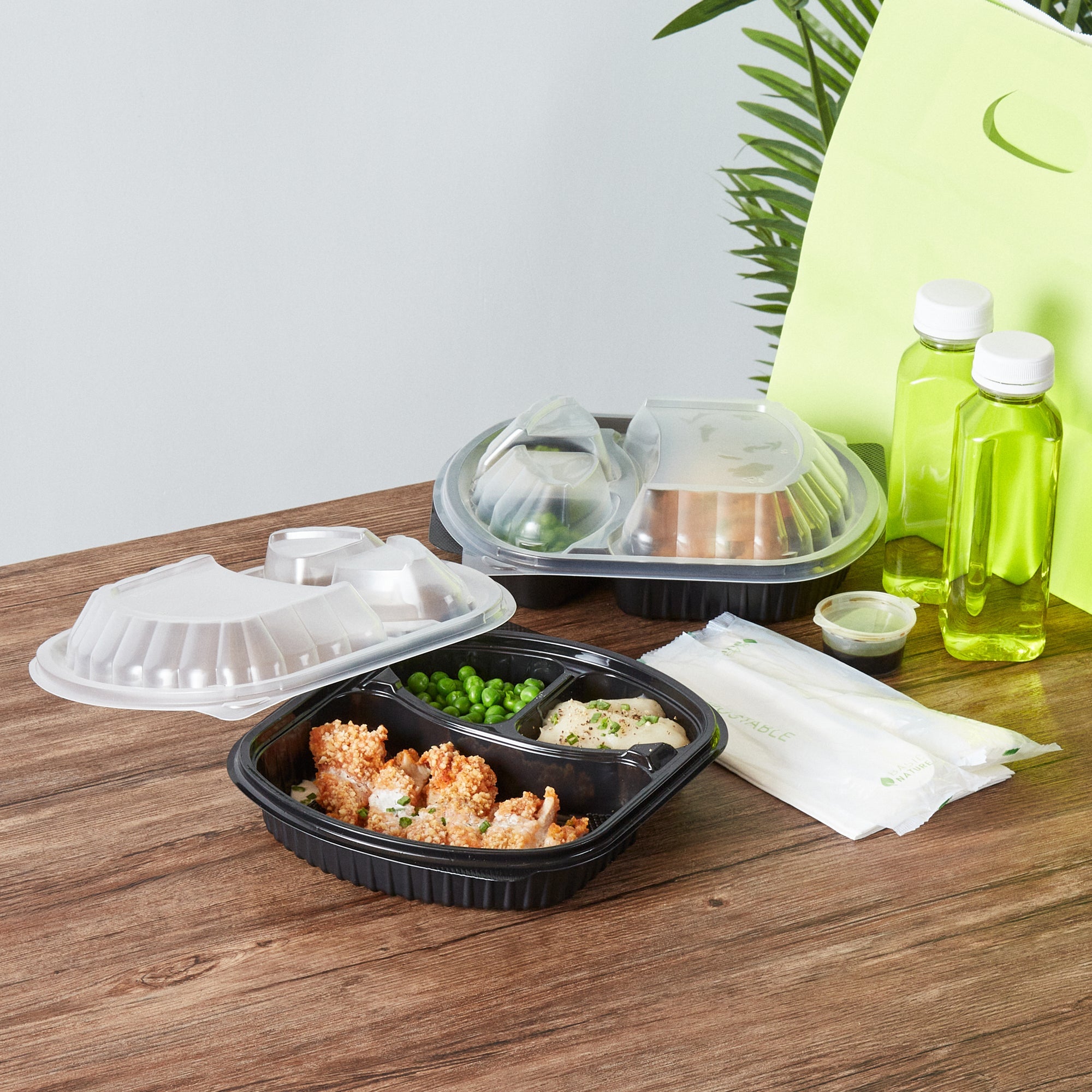 Chef 101 27 oz Oval Black Plastic Food Container - with Clear Lid, 3 Compartments, Microwavable - 9 1/2" x 8" x 2 3/4" - 50 count box