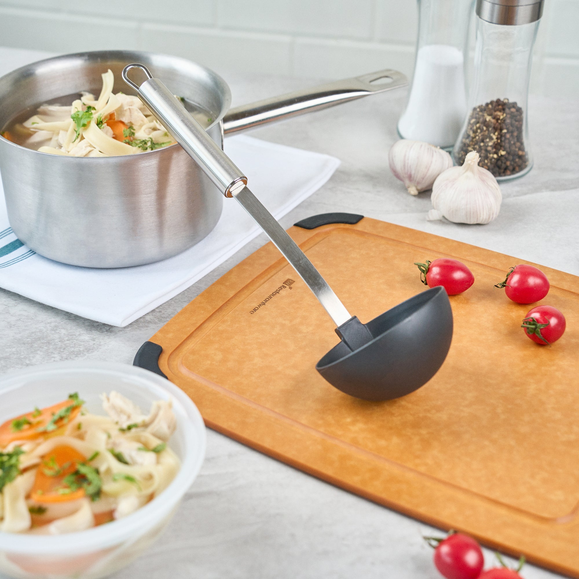German Standard Black Nylon High Heat Serving Ladle - One-Piece, with Stainless Steel Handle - 12 1/4'' x 3 1/2'' x 3 1/4'' - 1 count box
