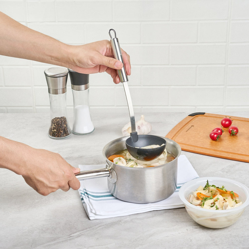 German Standard Black Nylon High Heat Serving Ladle - One-Piece, with Stainless Steel Handle - 12 1/4'' x 3 1/2'' x 3 1/4'' - 1 count box
