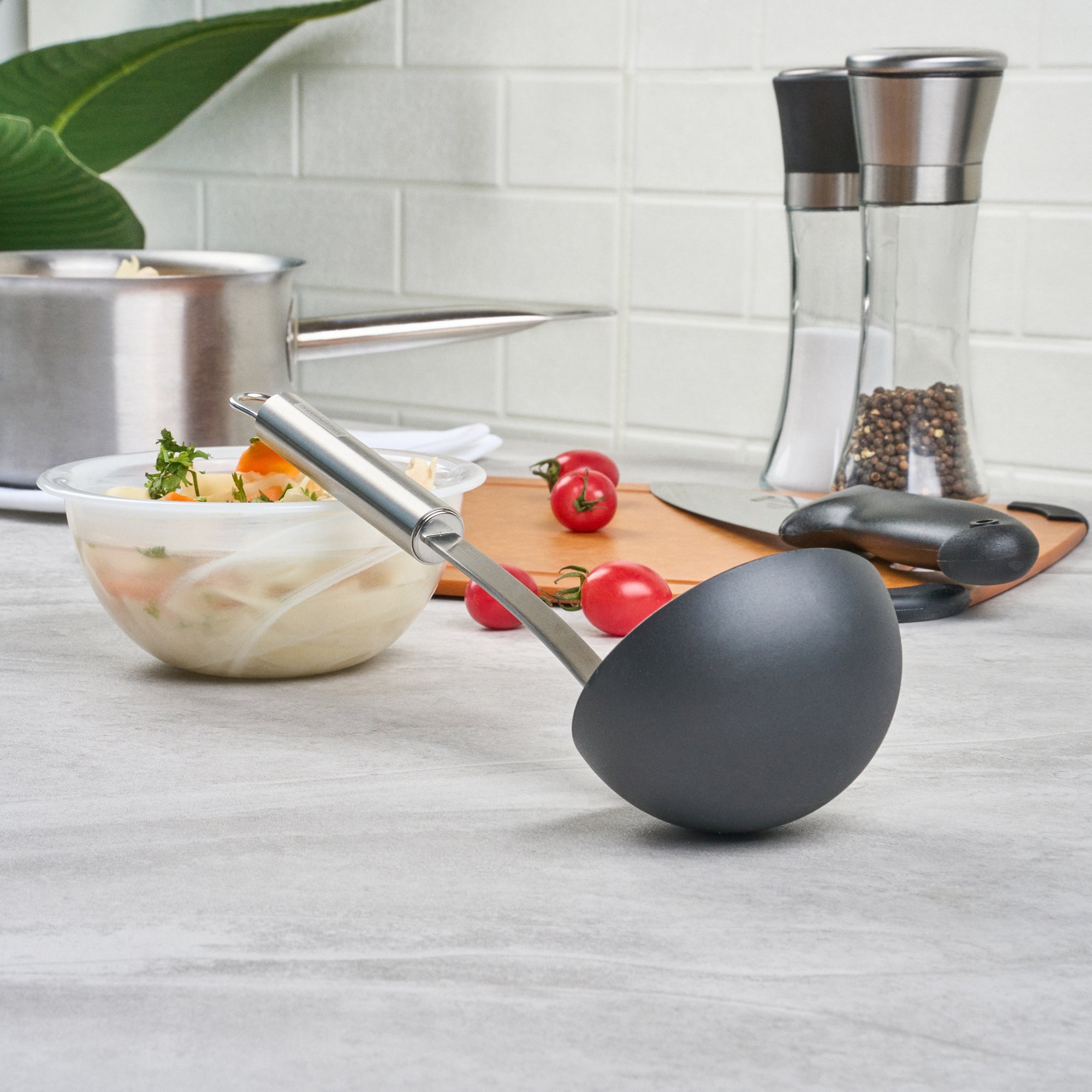 German Standard Black Nylon High Heat Serving Ladle - One-Piece, with Stainless Steel Handle - 12 1/4'' x 3 1/2'' x 3 1/4'' - 1 count box