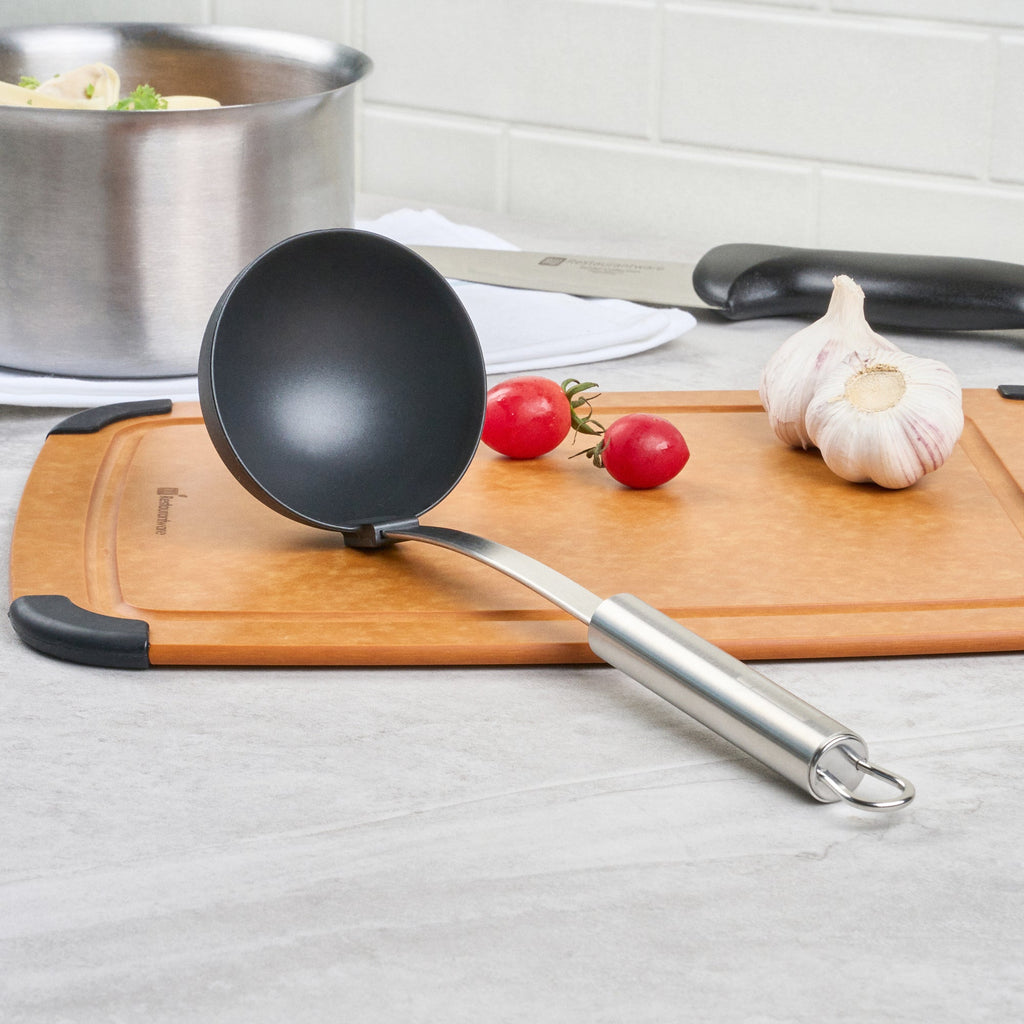 German Standard Black Nylon High Heat Serving Ladle - One-Piece, with Stainless Steel Handle - 12 1/4'' x 3 1/2'' x 3 1/4'' - 1 count box
