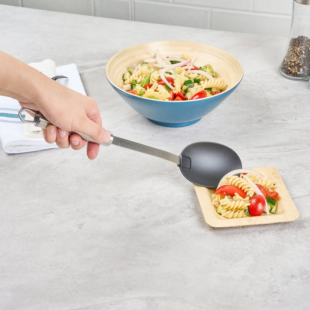German Standard Black Nylon High Heat Solid Serving Spoon - with Stainless Steel Handle - 12 1/2'' x 2 1/2'' x 1 1/2'' - 1 count box