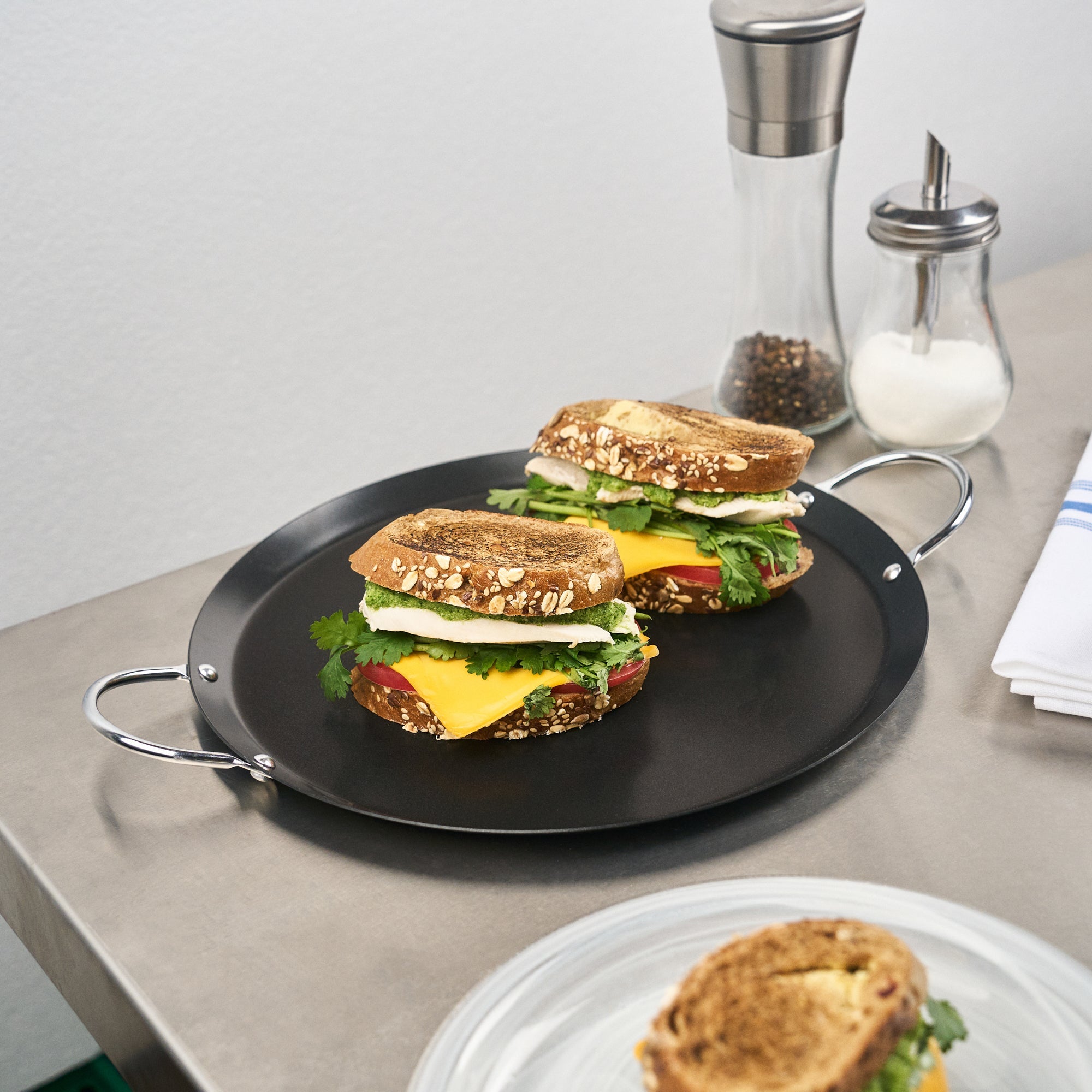 Met Lux Round Carbon Steel Griddle - Non-Stick, with Chrome Handles - 11" - 10 count box
