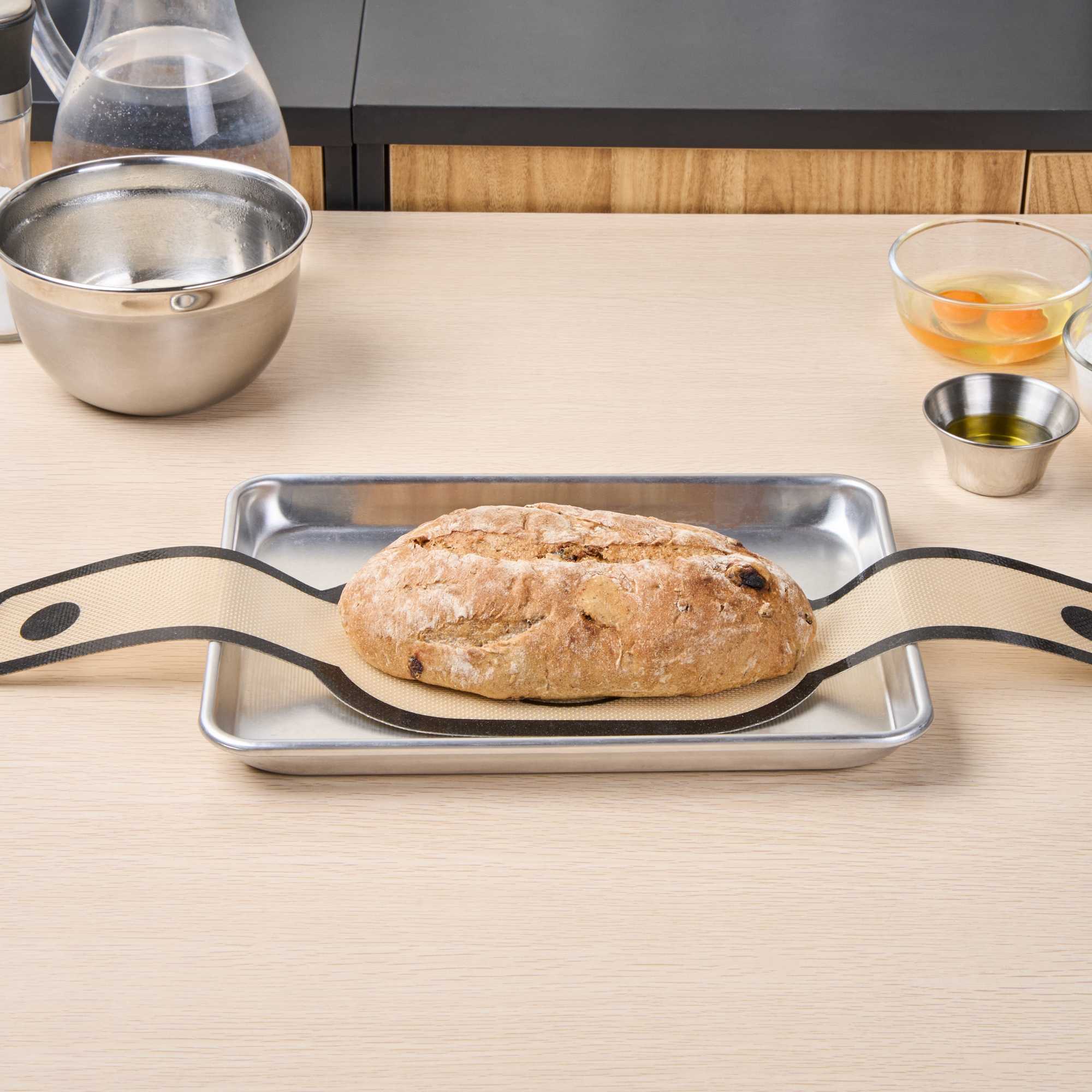 Pastry Tek Oval Tan and Black Fiberglass Bread Sling - For Dutch Oven, with Long Handles - 23 1/2" x 6" - 1 count box