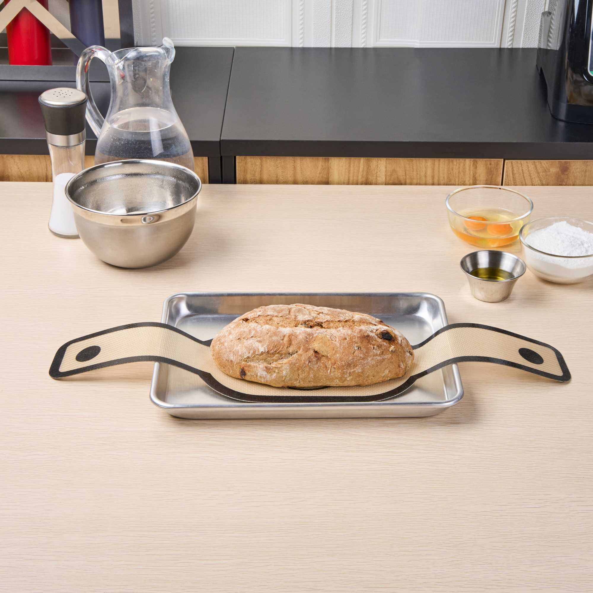 Pastry Tek Oval Tan and Black Fiberglass Bread Sling - For Dutch Oven, with Long Handles - 23 1/2" x 6" - 1 count box