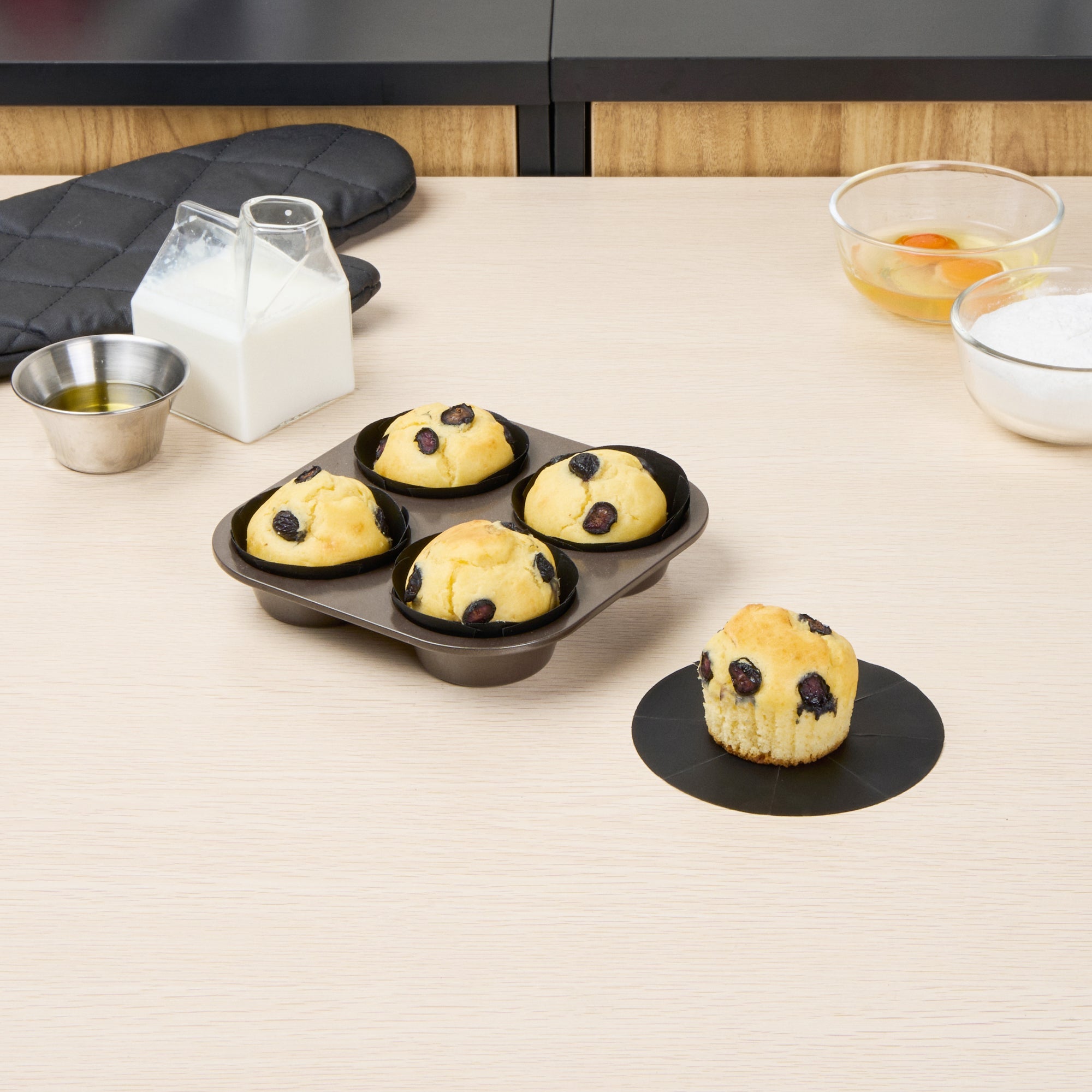 Pastry Tek Round Black Fiberglass Cupcake / Muffin Liner - Non-Stick, Foldable - 2" x 2" - 12 count box