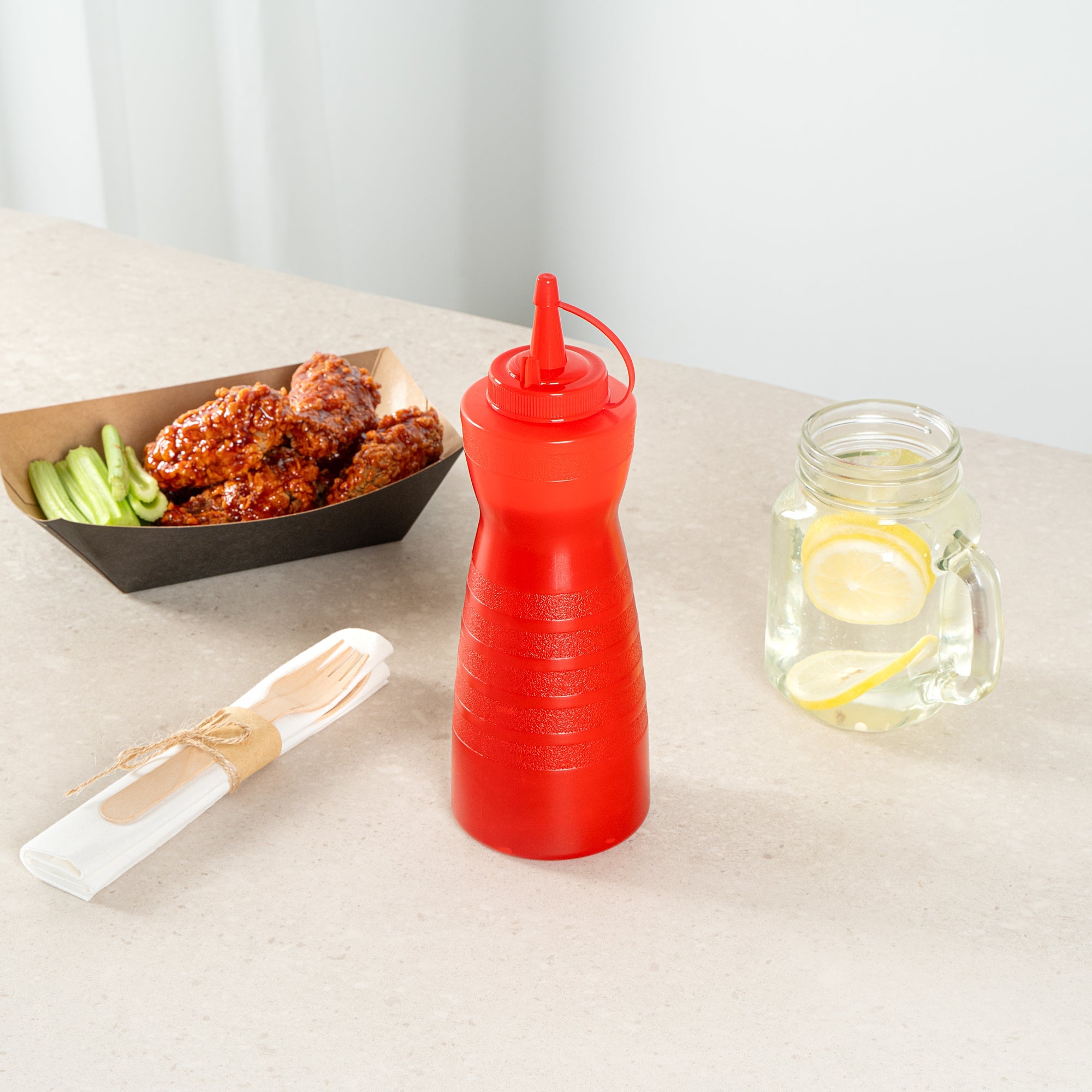 Sauce Tek 24 oz Red Plastic Squeeze Bottle - with Cap - 2 3/4" x 2 3/4" x 10 1/4" - 1 count box