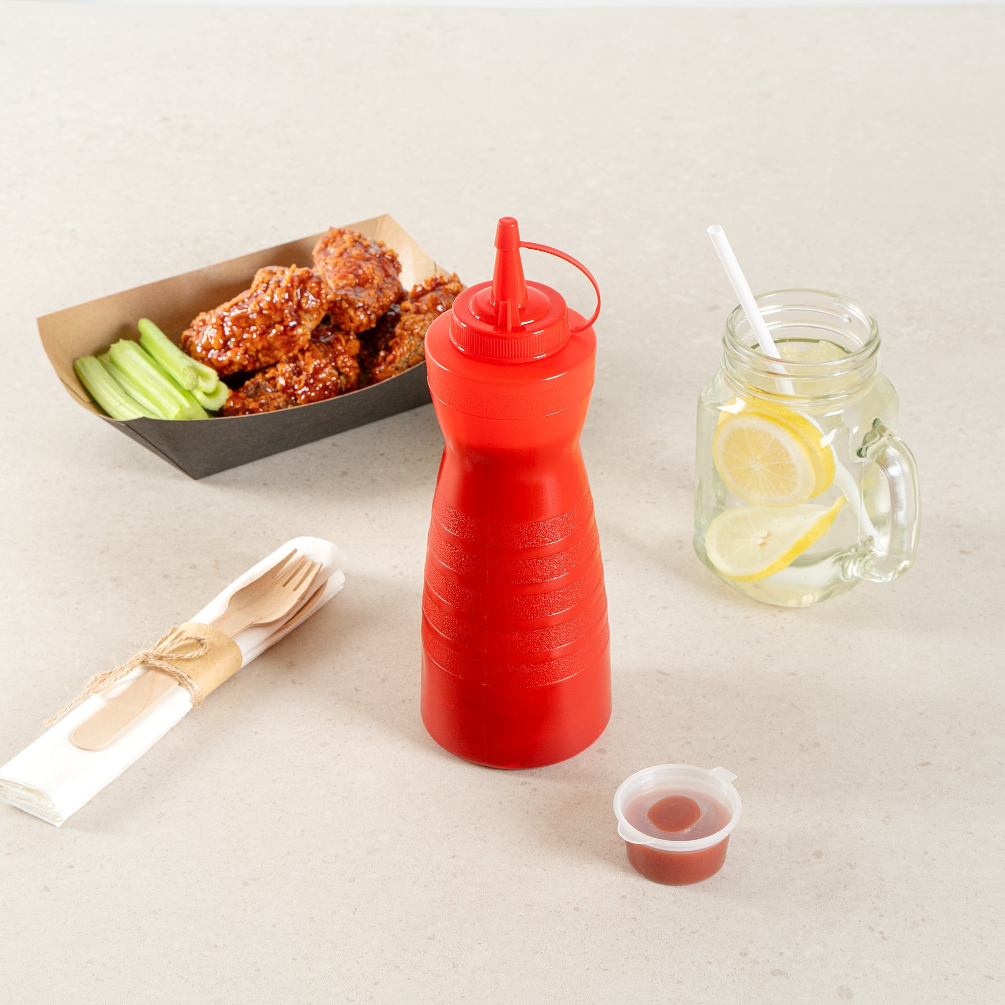Sauce Tek 24 oz Red Plastic Squeeze Bottle - with Cap - 2 3/4" x 2 3/4" x 10 1/4" - 1 count box