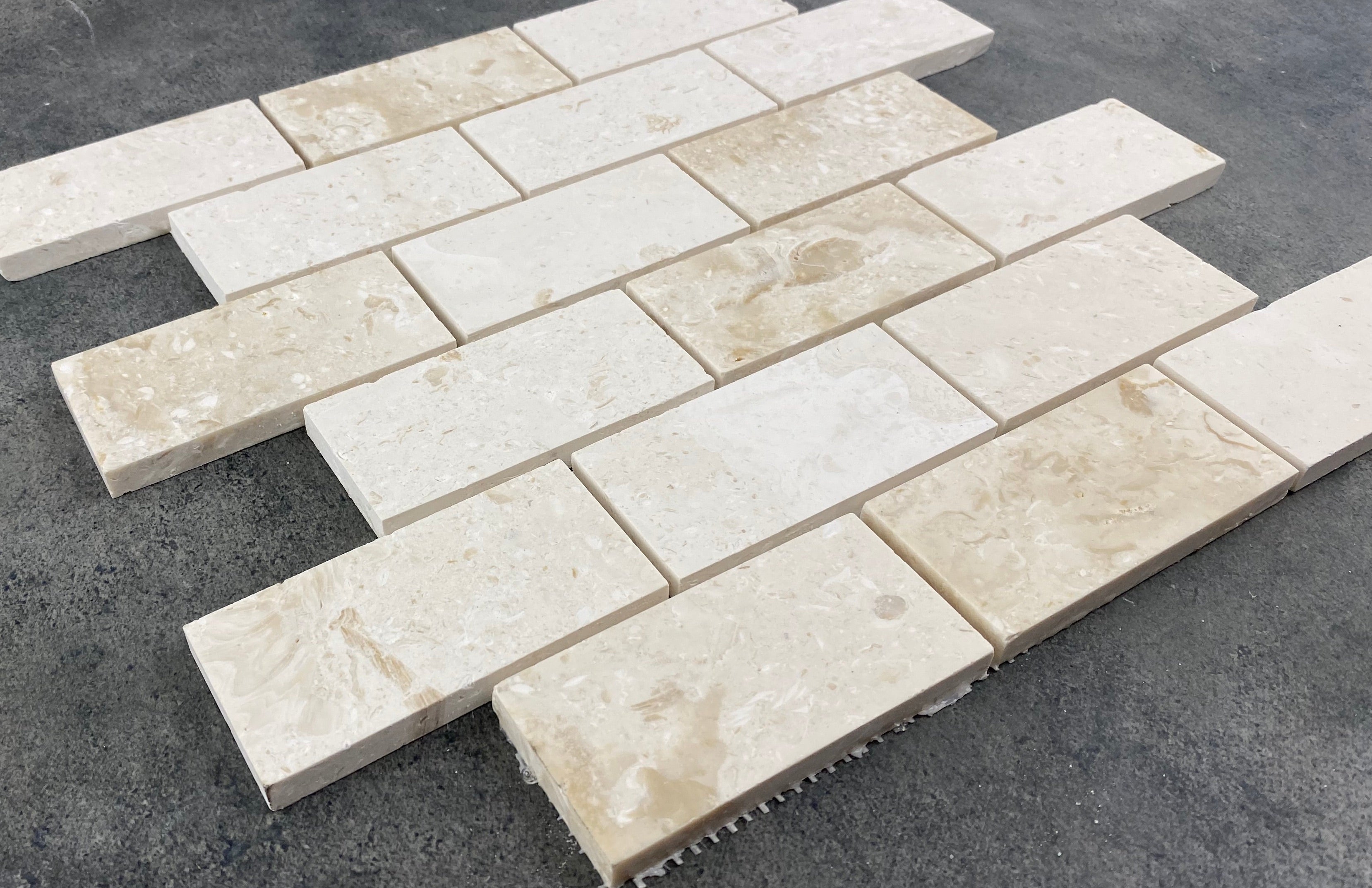Shell Stone Limestone Brick Mosaic Tile - Honed 2x4 Mesh Backed