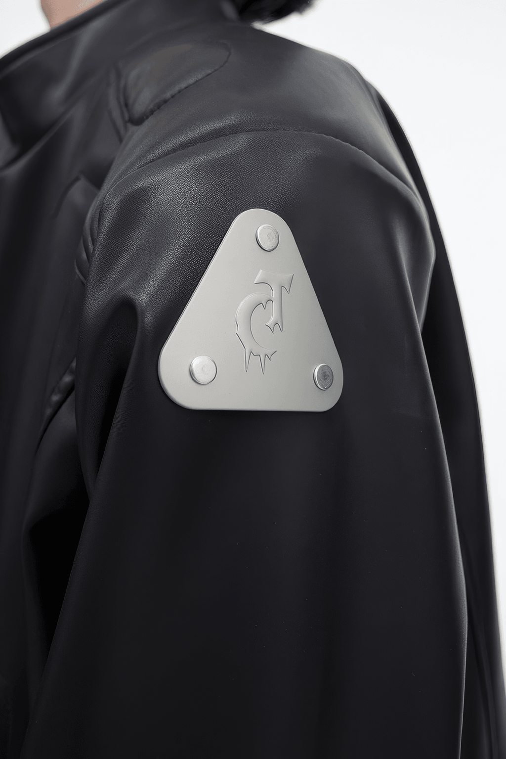 Short Leather Jacket – Modern Sculptural Design with Metal Logo