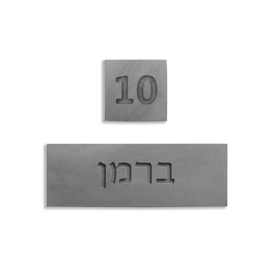 A designed sign for the entrance to a house with names made of natural concrete in gray with engraving - Concrete Chic series