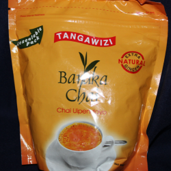 Angled front view of orange Baraka Chai Tangawizi pouch showing full label and chai cup