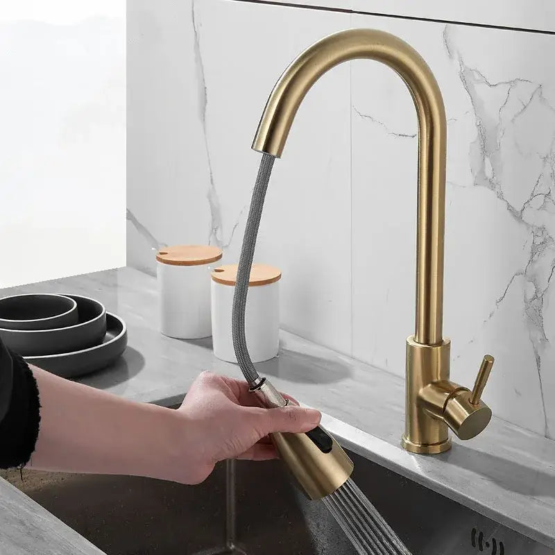Brushed gold kitchen faucet with pull down spray head