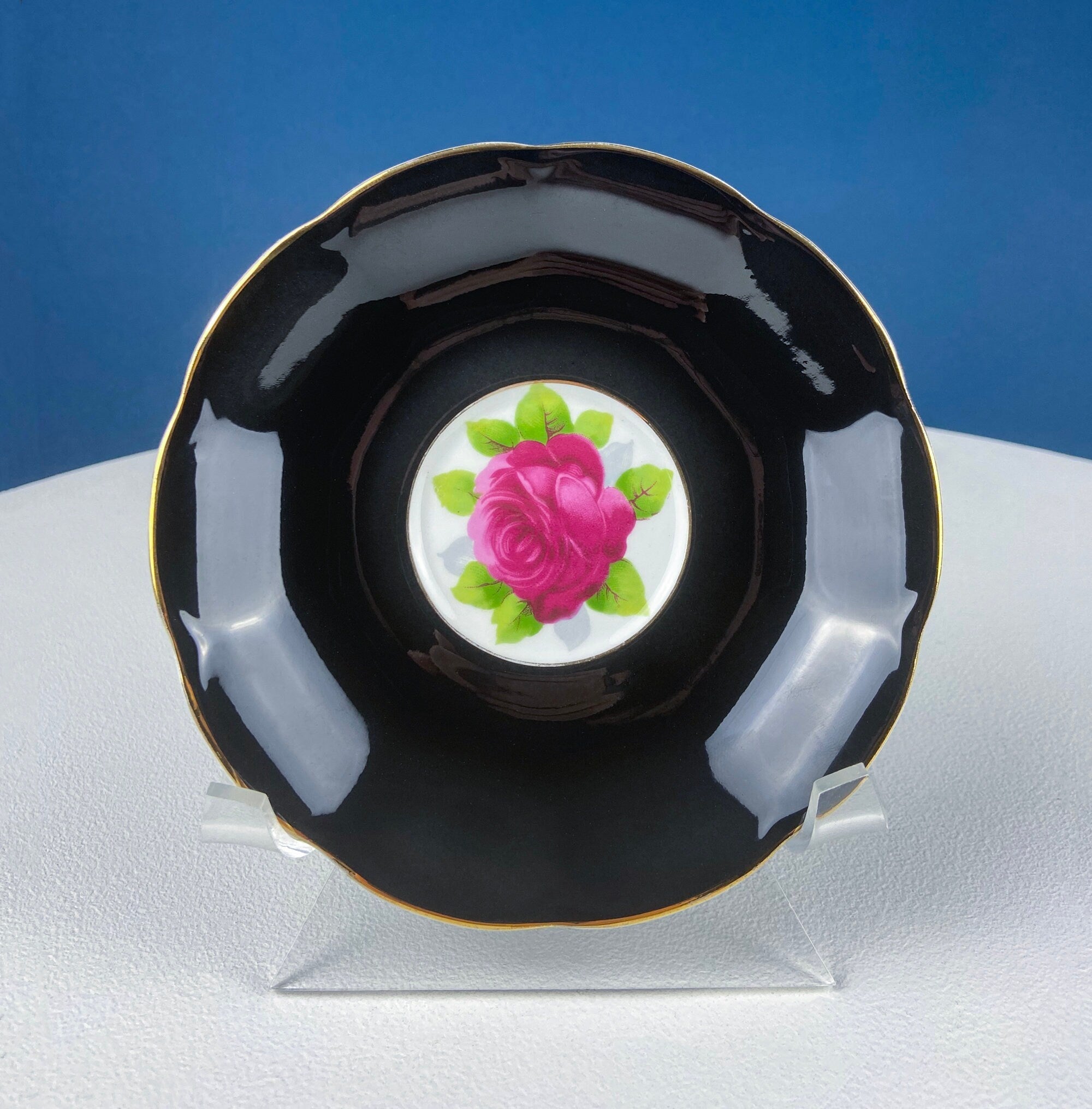 Black Cup and Saucer with Roses on White Background Inside the Cup. Royal Albert Old Country Rose Tea Set. Hand Painted Pink & Red Roses.