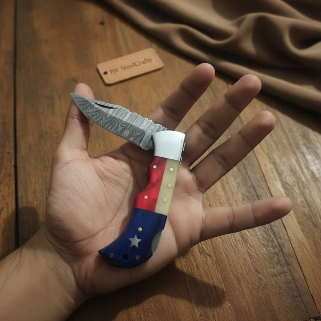 Handmade Damascus Folding Knife – Tricolor Resin Handle (Red, White & Blue) with Leather Sheath
