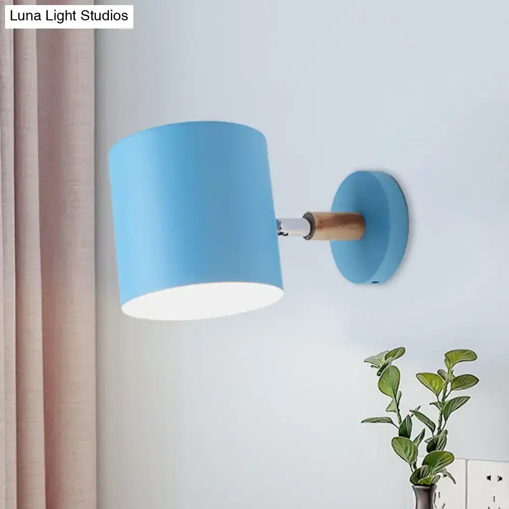 Modern blue metal tubular wall lamp with wood arm bedroom sconce light