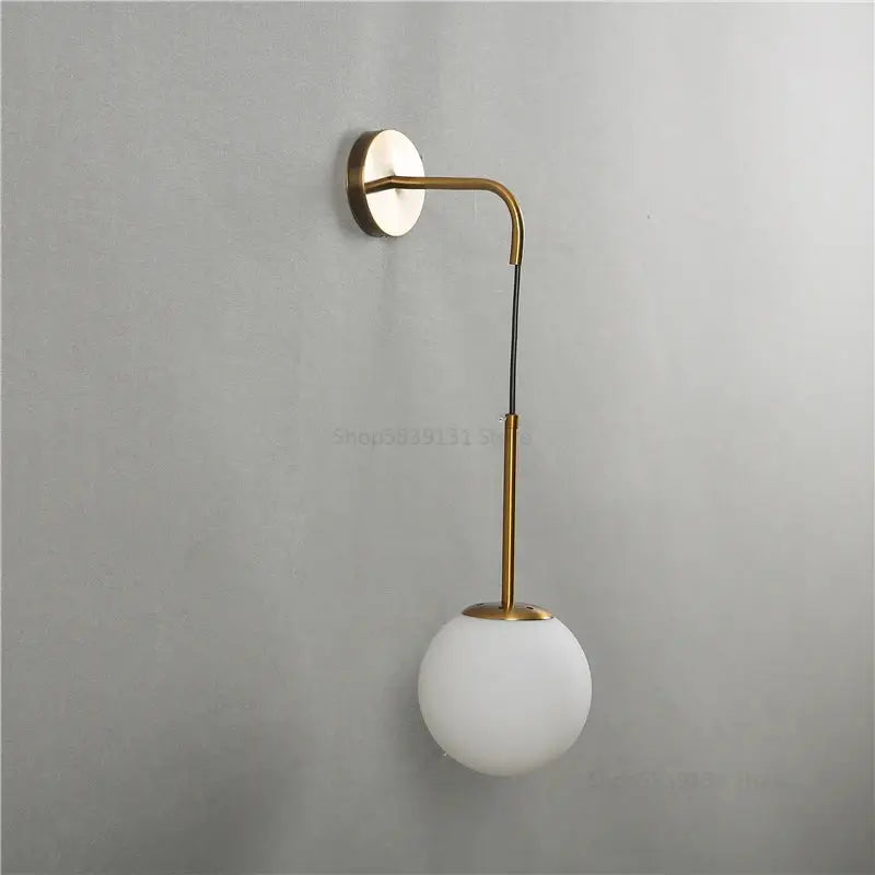 Modern brass and glass ball wall lamp for bedroom decor